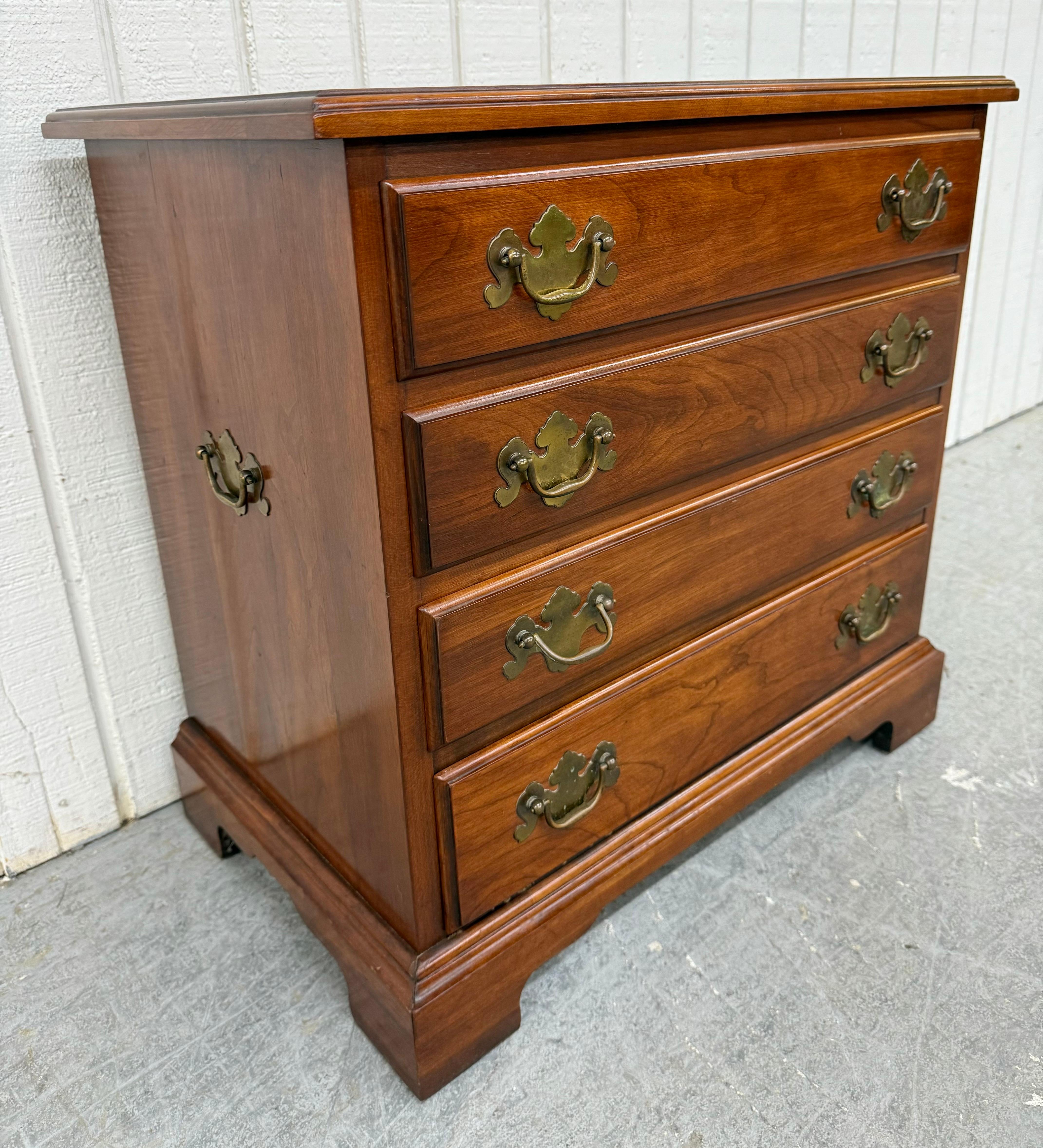 This listing is for a Vintage Henkel Harris Cherry Nightstand. Featuring a straight line traditionalist design, solid cherry wood, four dovetailed drawers, original brass pulls, and a beautiful cherry finish. This is an exceptional combination of
