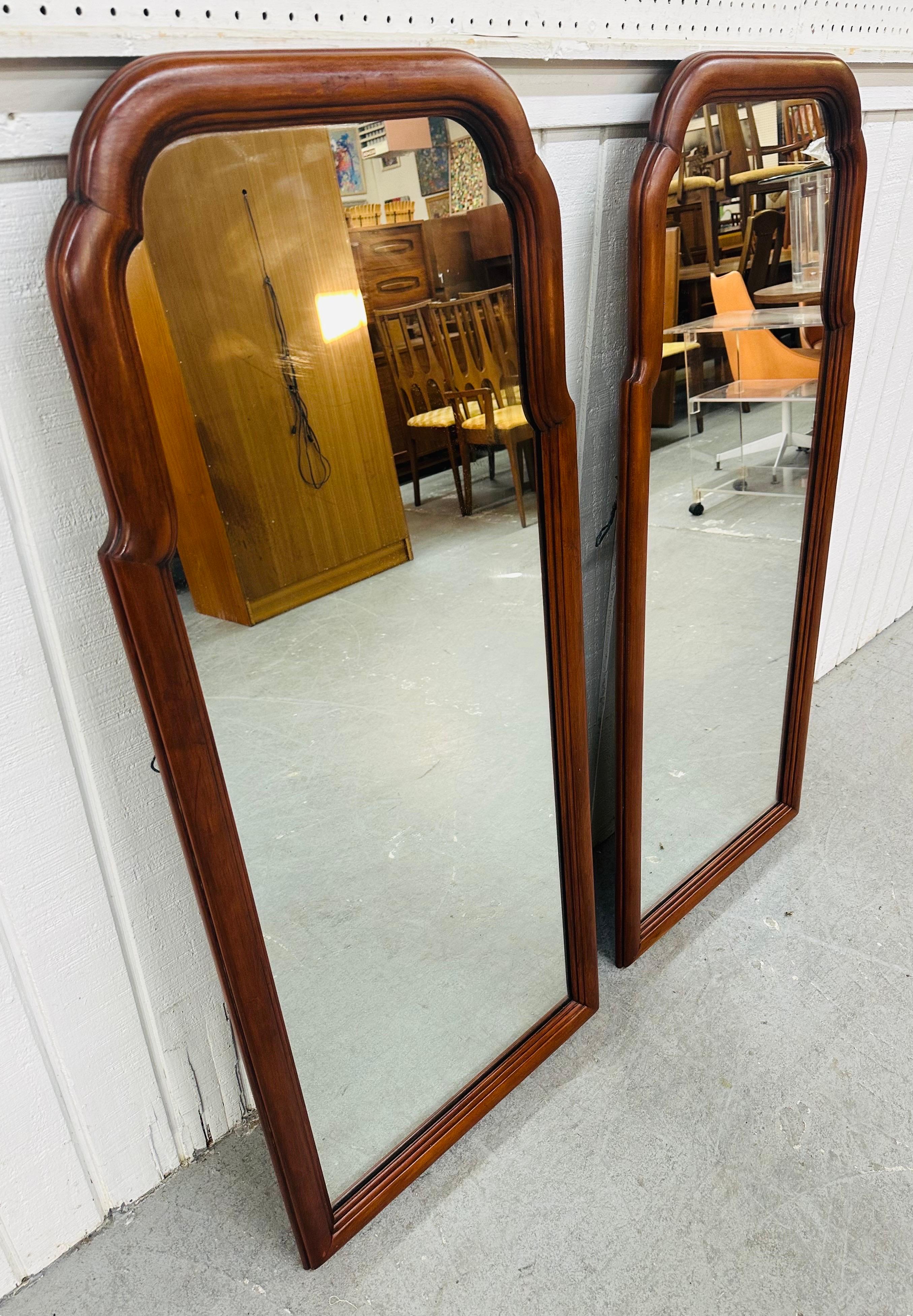 This listing is for a pair of Vintage Henkel Harris Cherry Wood Mirrors. Featuring a traditional style, solid cherry wood frames, and original mirrors. This is an exceptional combination of quality and design by Henkel Harris!