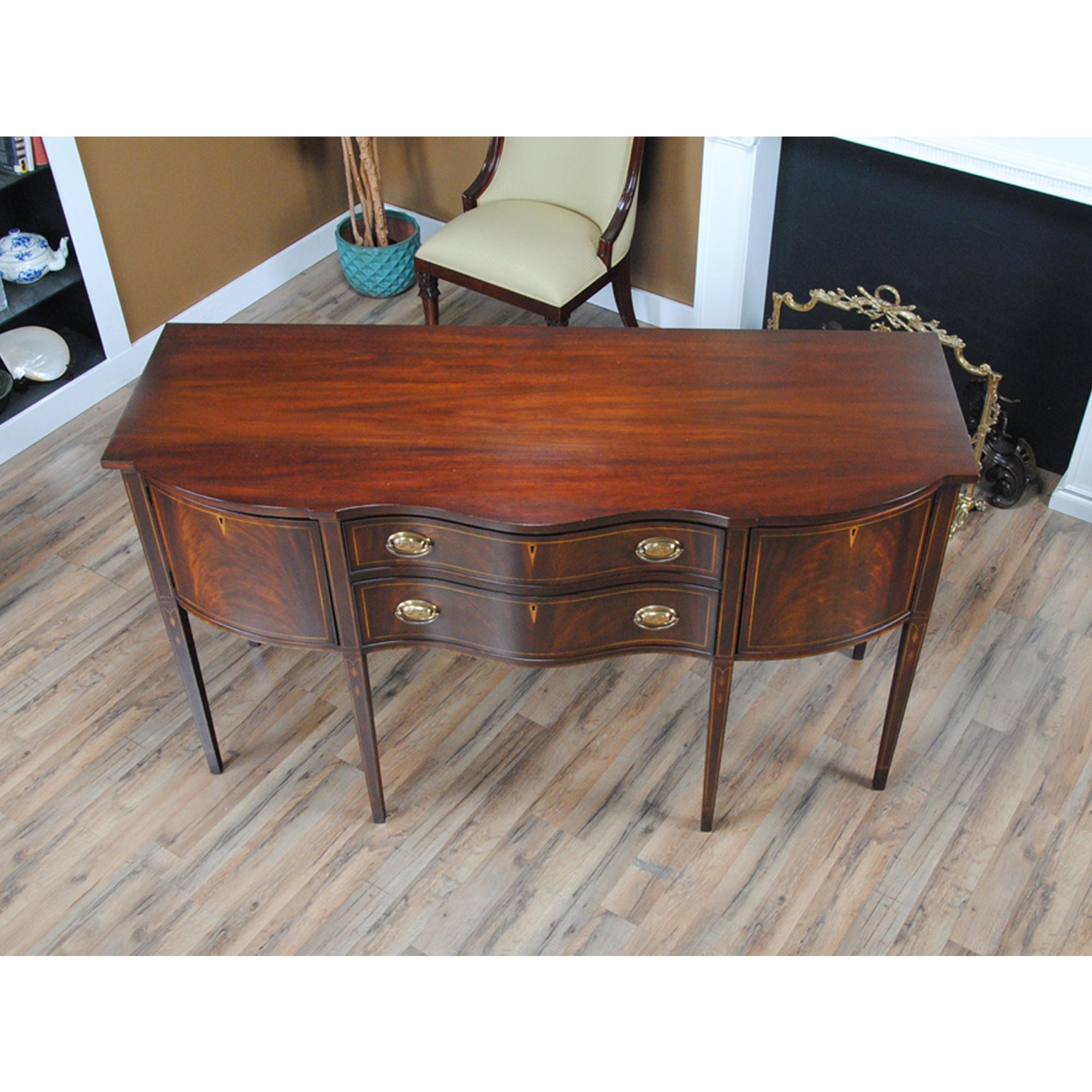 A Vintage Henkel Harris Inlaid Sideboard in excellent original, as found, condition.

Simple yet sophisticated this beautiful Henkel Harris Sideboard has everything going for it. A slightly deeper size than many other high leg sideboards this item