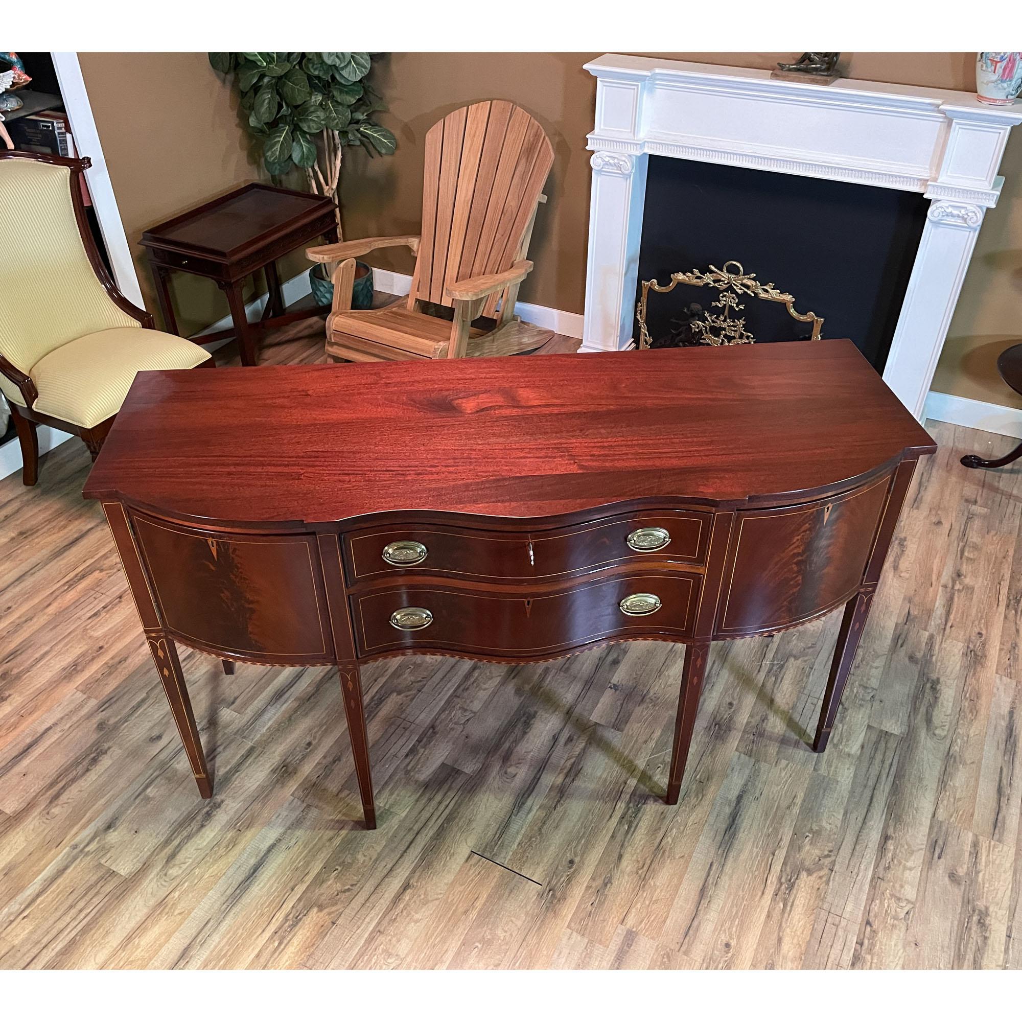 A Vintage Henkel Harris inlaid sideboard in excellent condition with a freshly hand rubbed top giving the sideboard a clean appearance.

Simple yet sophisticated this beautiful Henkel Harris Sideboard has everything going for it. A slightly deeper