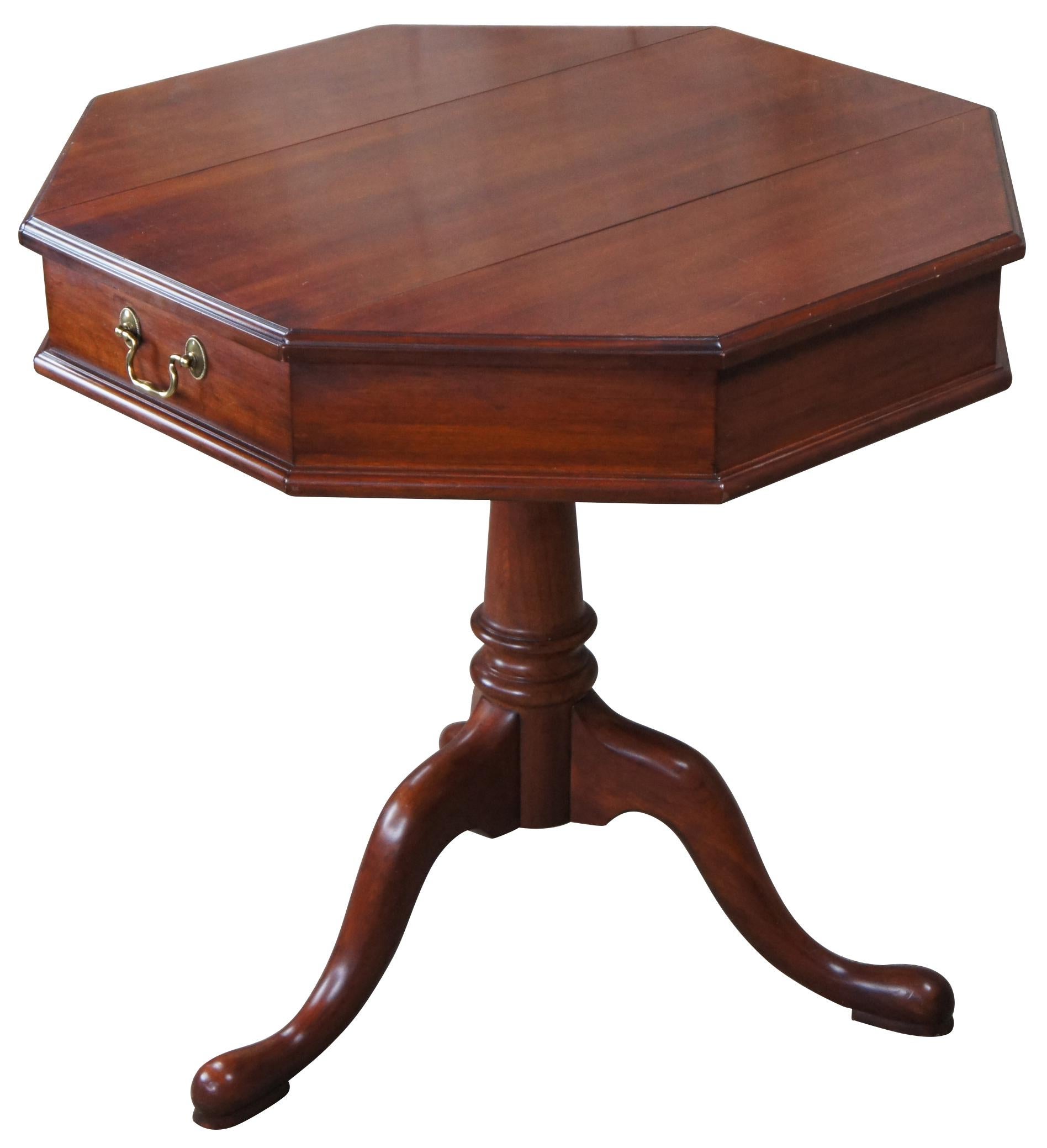 Vintage Henkel Harris Jefferson Queen Anne pedestal side, accent or center table. Made of Wild Black Cherry featuring octagonal form with two incognito flip top storage compartments and tripod base with pad feet. 

The Henkel-Harris legacy started