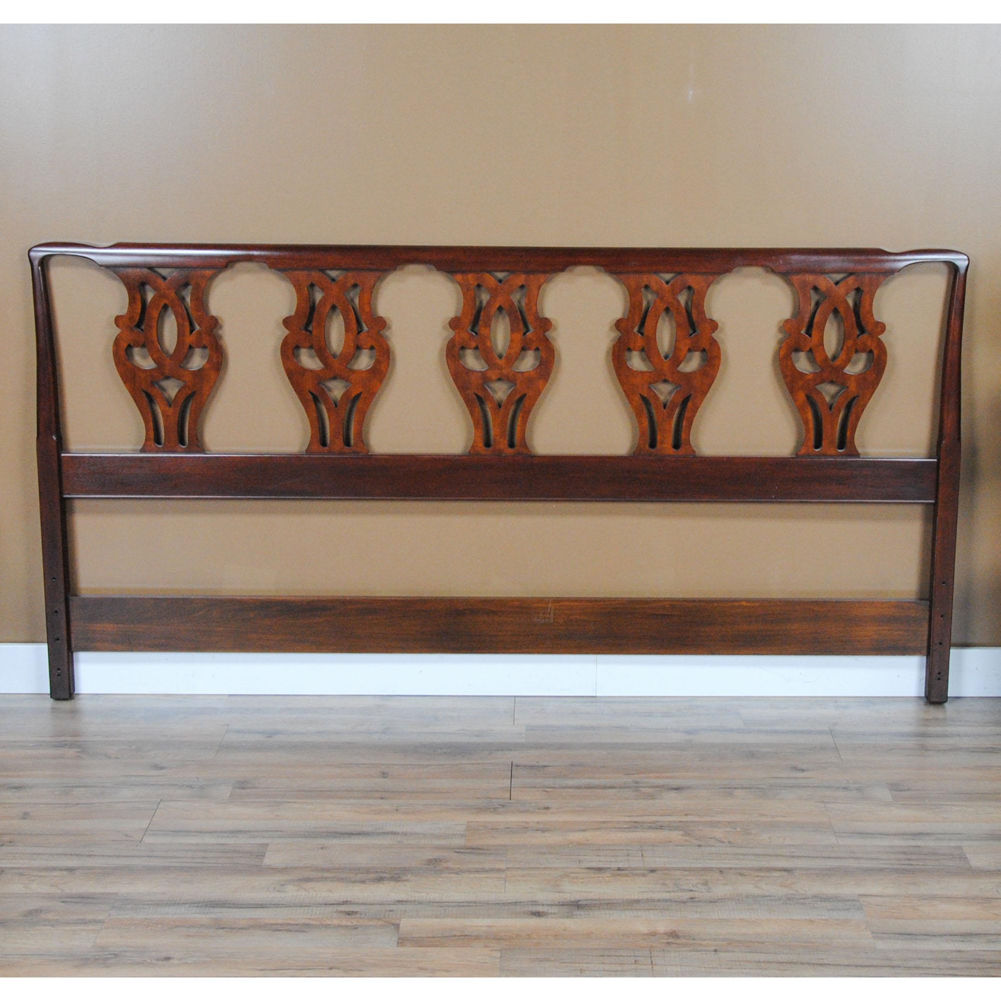 This Vintage Henkel Harris King Size Headboard was manufactured using solid mahogany on all exposed surfaces. The attention to detail and expert craftsmanship is apparent throughout the headboard. Every detail on this item is as crisp as the day it
