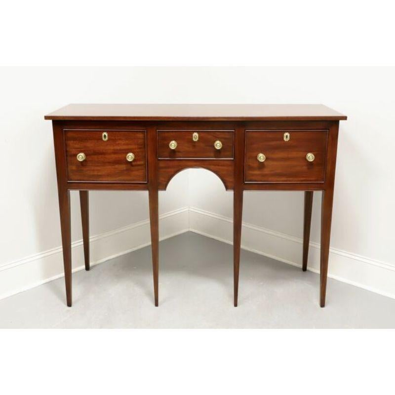 A rare find, a Traditional style huntboard by Henkel Harris of Winchester, Virginia, USA. Solid mahogany with brass hardware and tapered straight legs. Features three drawers of dovetail construction, each with a working lock and center drawer being