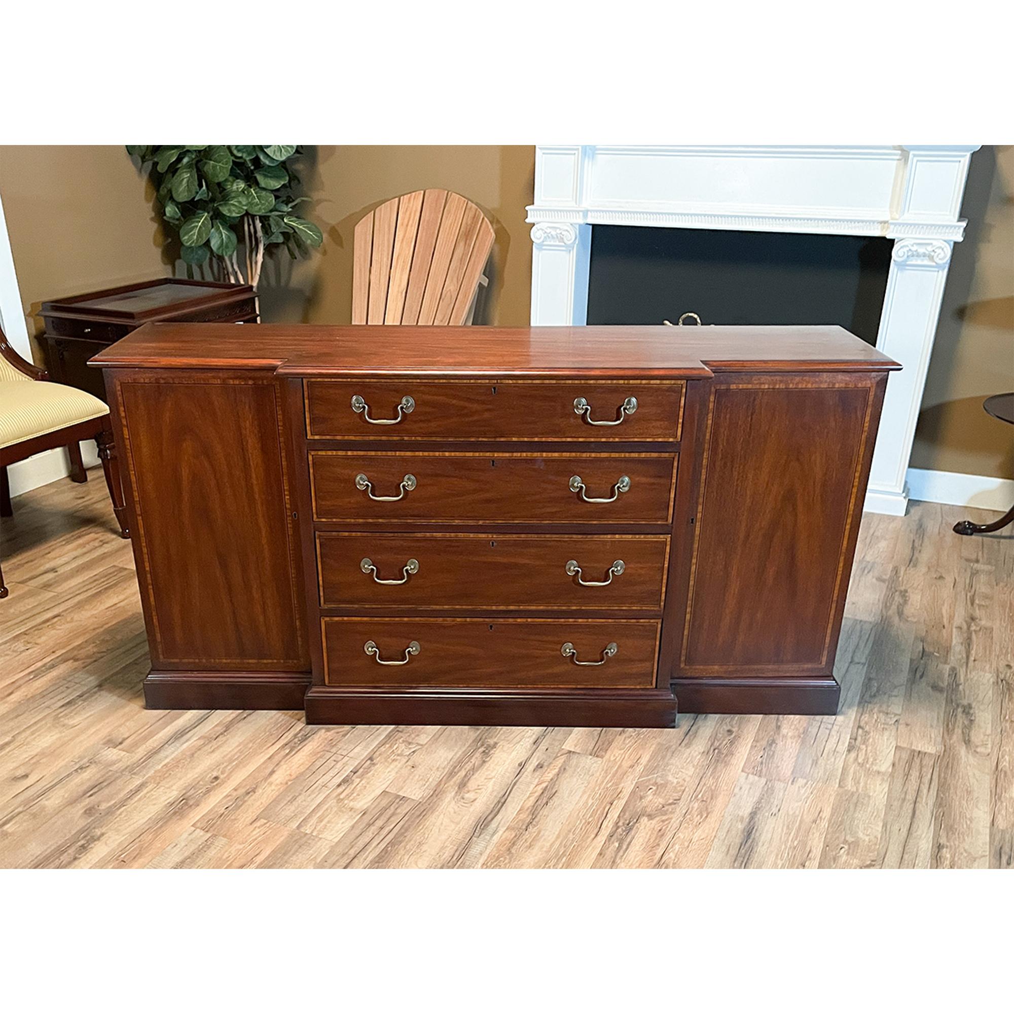 A Vintage Henkel Harris Two Piece Breakfront brought to you by Niagara Furniture. This china closet is impressive in both it’s design and scale. Made of beautifully grained solid mahogany, the bookcase top features glass shelves as well as original