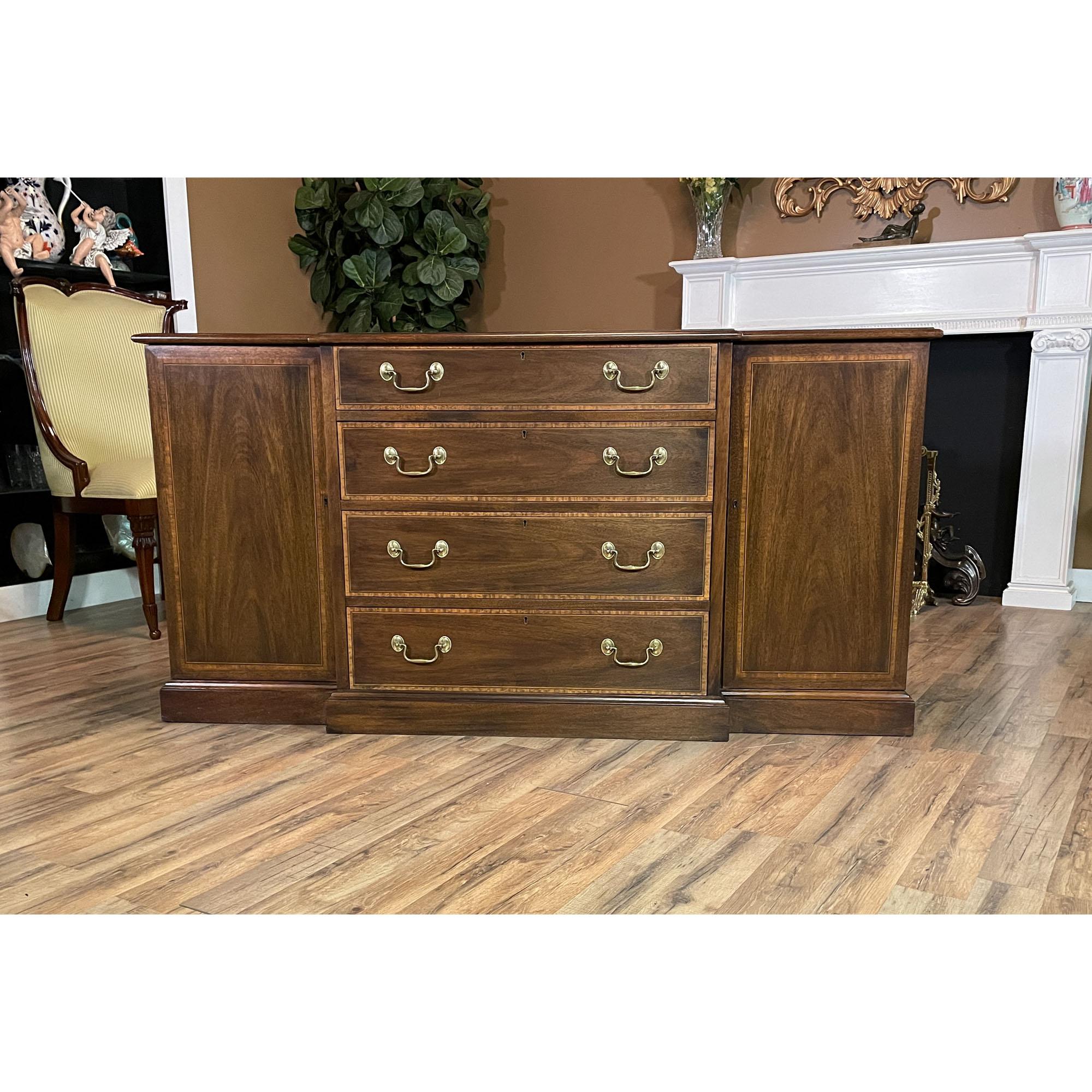 A Vintage Henkel Harris Two Piece Breakfront brought to you by Niagara Furniture. This china closet is impressive in both it’s design and scale. Made of beautifully grained solid mahogany, the bookcase top features glass shelves as well as original