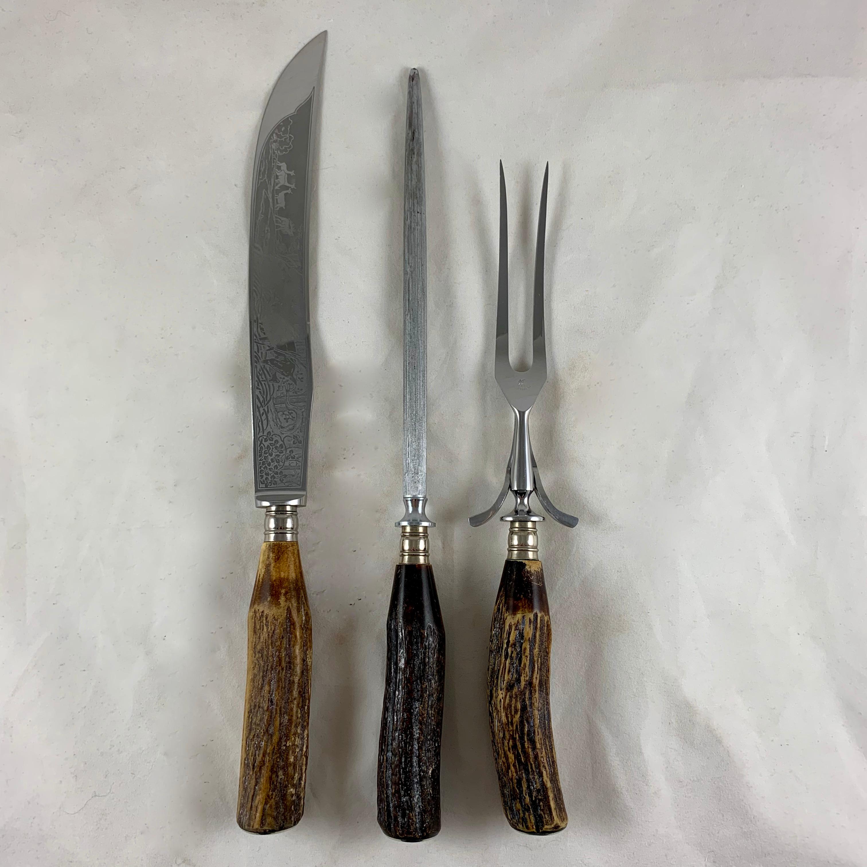 A vintage boxed carving set from Henkels Zwillingswerk, circa 1960s-1970s.
A carving knife, fork, and sharpening steel made with naturally shed Roe Buck Stag Horn handles and Friodur Soligen steel. The blade is etched with a scene showing a