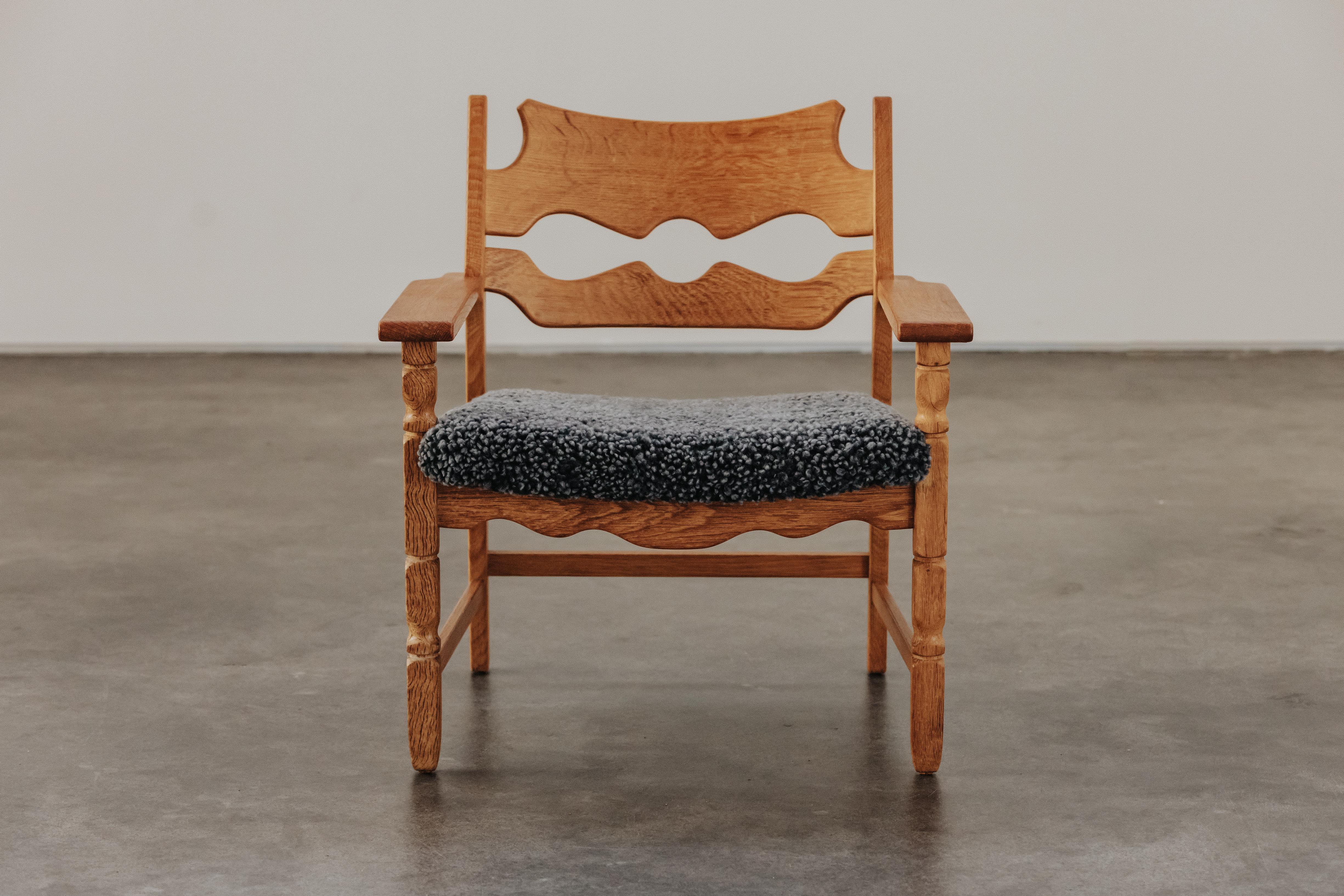 Vintage Henning Kjaernulf Razor Lounge Chair From Denmark, Circa 1960.  Solid oak construction, later upholstered in very soft sheepskin.  Light wear and use.  