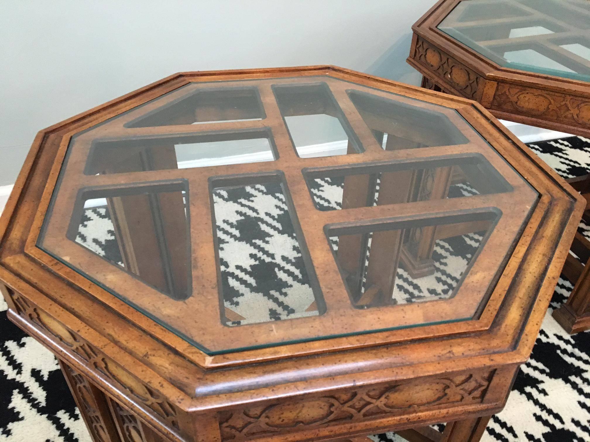 Rare octagon Henredon end tables in Chinese chinoiserie or Chippendale style. Glass tops inset on fretwork. Carved detailing on double legs. Excellent vintage condition.