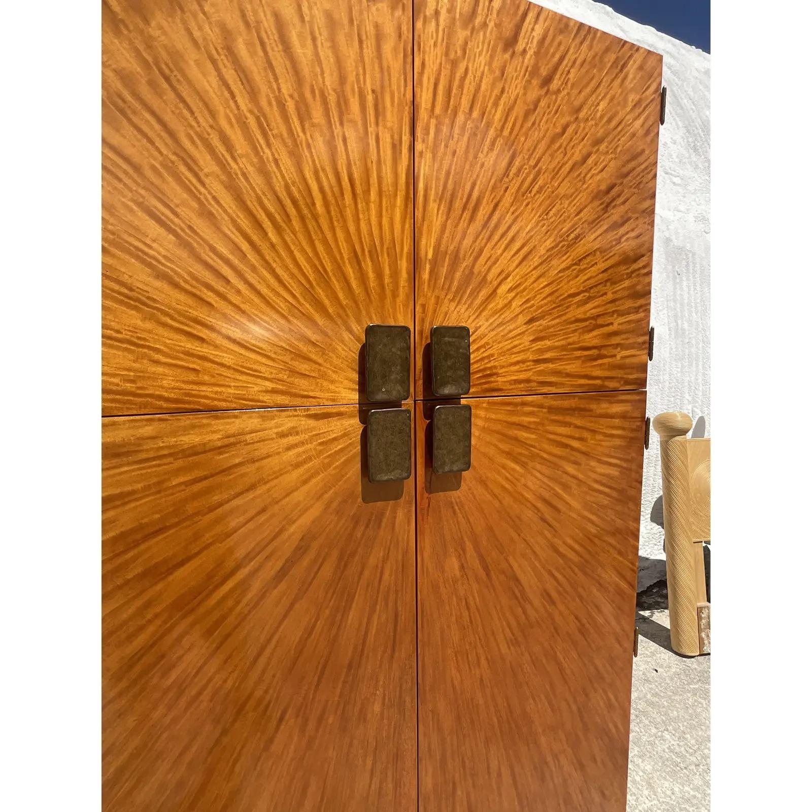 Incredible vintage Henredon Arbus armoire. Stunning bookmatched burl wood in an epic starburst pattern. Monumental solid brass pulls lots of great storage inside with shelves and drawers. Acquired from a Miami estate.