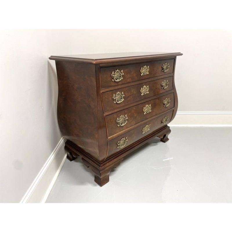 A Chippendale style bombe chest by Henredon. Burl walnut with a lightly distressed finish, ogee bracket feet and brass hardware. Features four drawers of dovetail construction with faux lockplates. Made in the USA, in the late 20th Century. 

Style