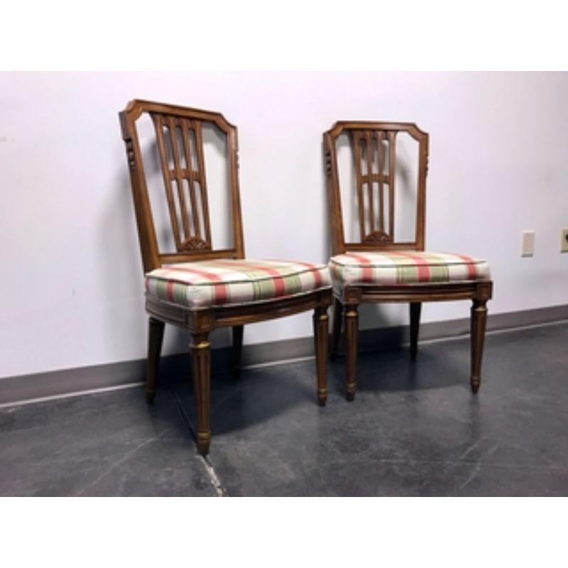 A pair of Mid Century Italian Provincial Neoclassical Style dining side chairs by Henredon, from their Capri line. Solid wood with carved backsplat, striped fabric upholstered seat and fluted legs. Made in North Carolina, USA, in the mid 20th
