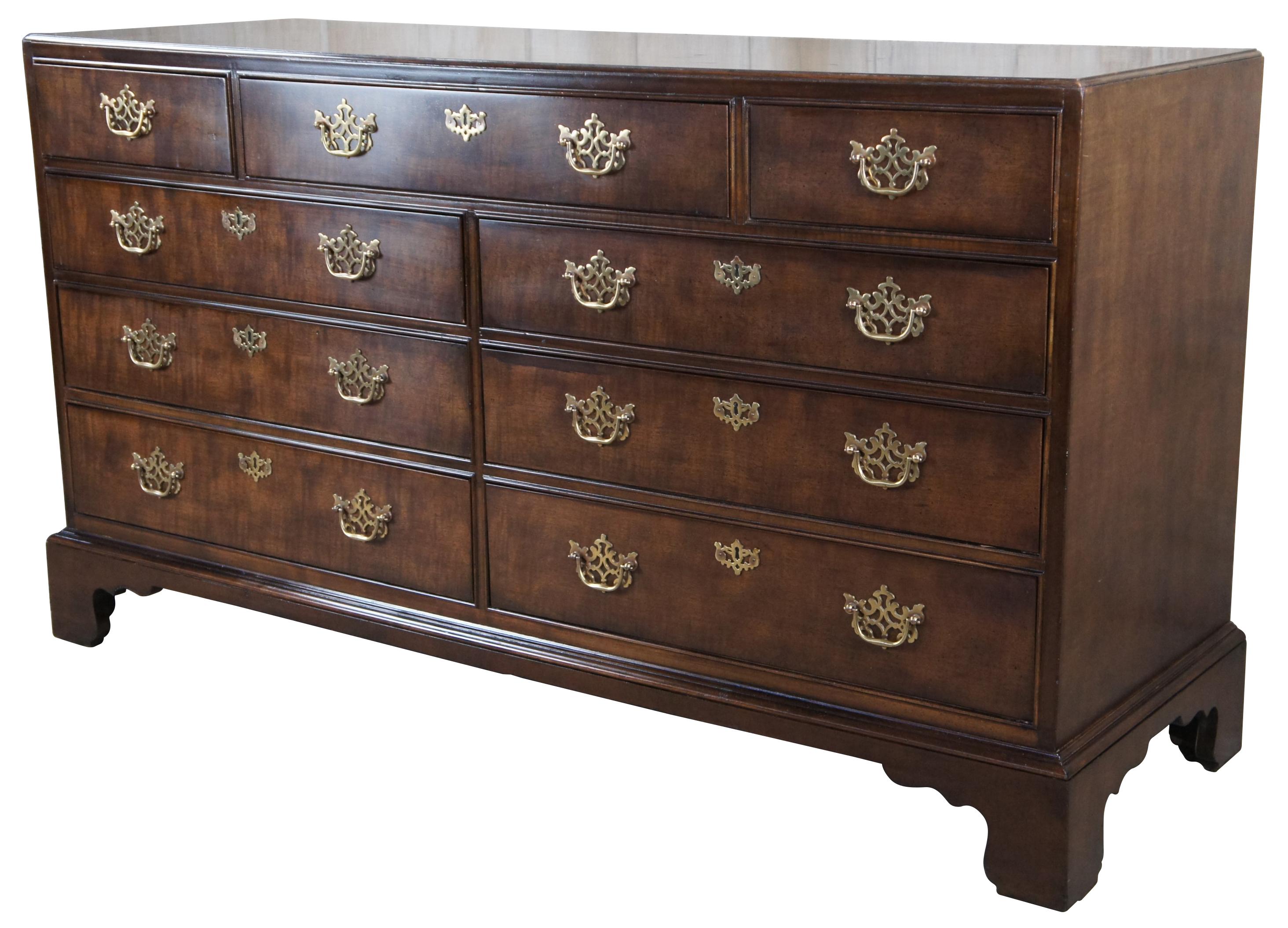 Vintage Henredon Chippendale and Georgian inspired double dresser 3400-01, circa 1984. Made from mahogany with 9 dovetailed drawers, pierced batwing bale hardware and faux escutcheon. The case is raised over bracket feet.