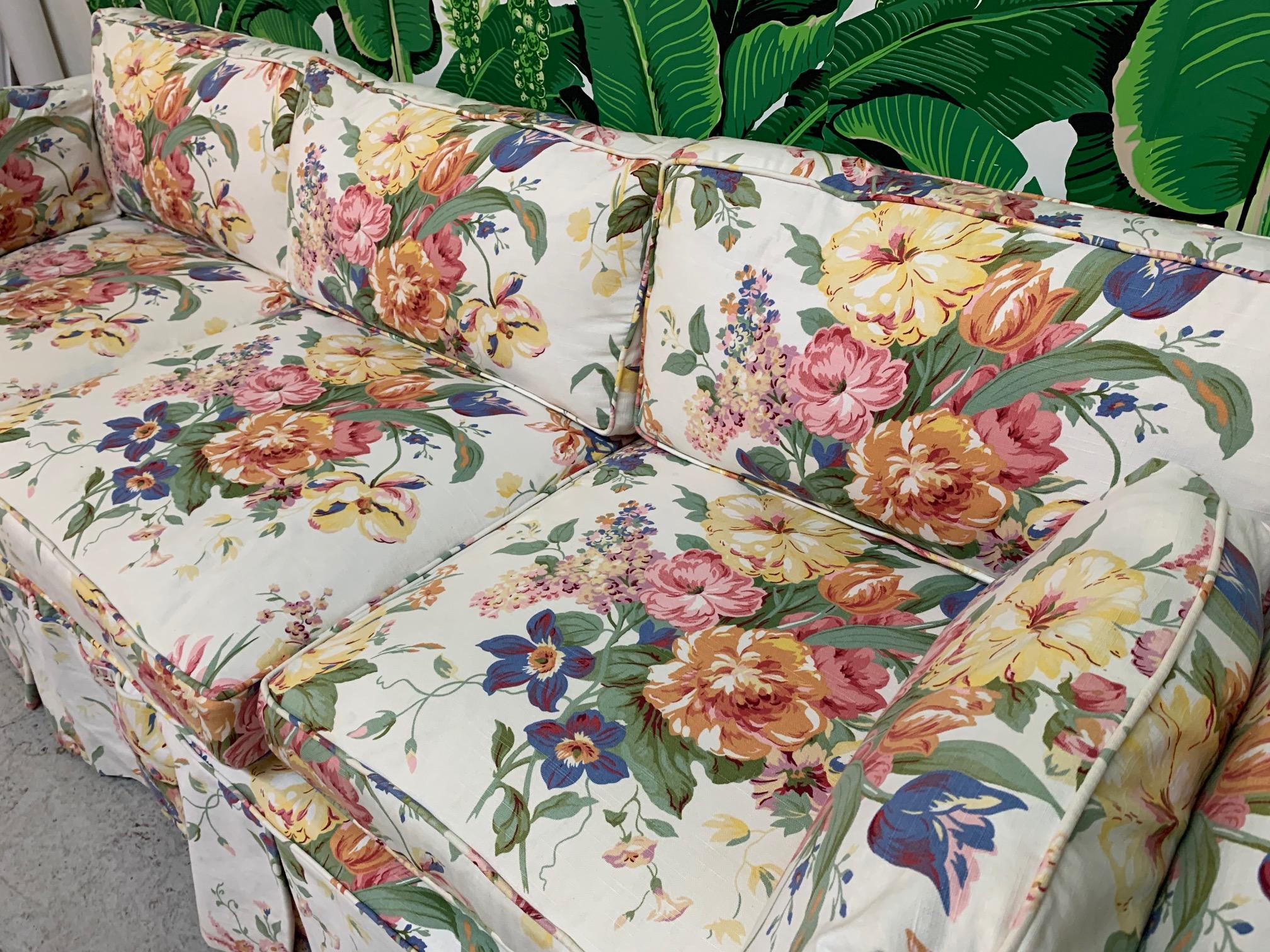 Vintage midcentury sofa by Henredon features slip cover in a Ralph Lauren floral print. Down-filled spring cushions can be unzipped for easy cleaning, and main cover is also easily removed. Great vintage condition with only very minor imperfections