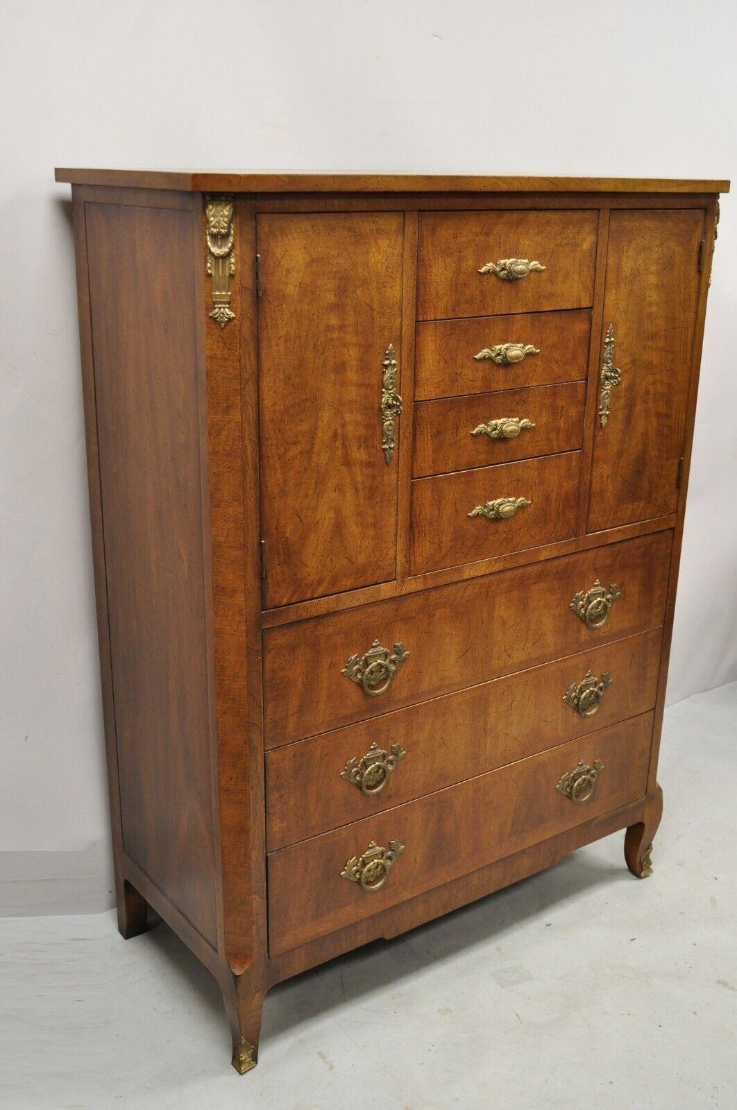 Vintage Henredon French Louis XV Style Banded Walnut Tall Chest Dresser. Item features an ornate brass ormolu, leafy scroll and urn form back plates, banded wood inlay to front and top, beautiful wood grain, 2 swing doors, original stamp, 7