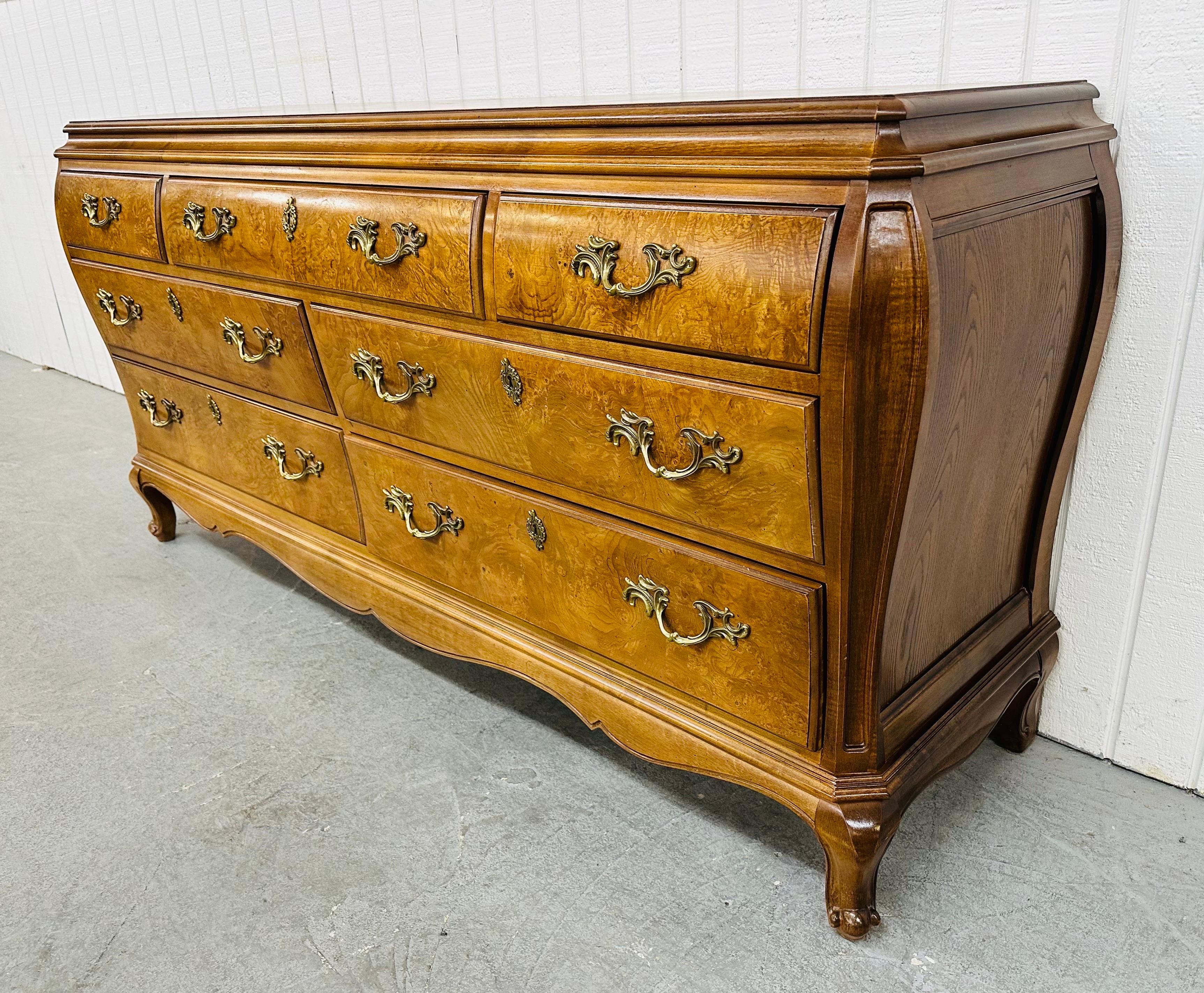 This listing is for a Vintage Henredon French Provincial Burled Wood Dresser. Featuring seven drawers for storage, original French style hardware, French style leg, Bombay shaped sides, and a beautiful burled wood finish. This is an exceptional