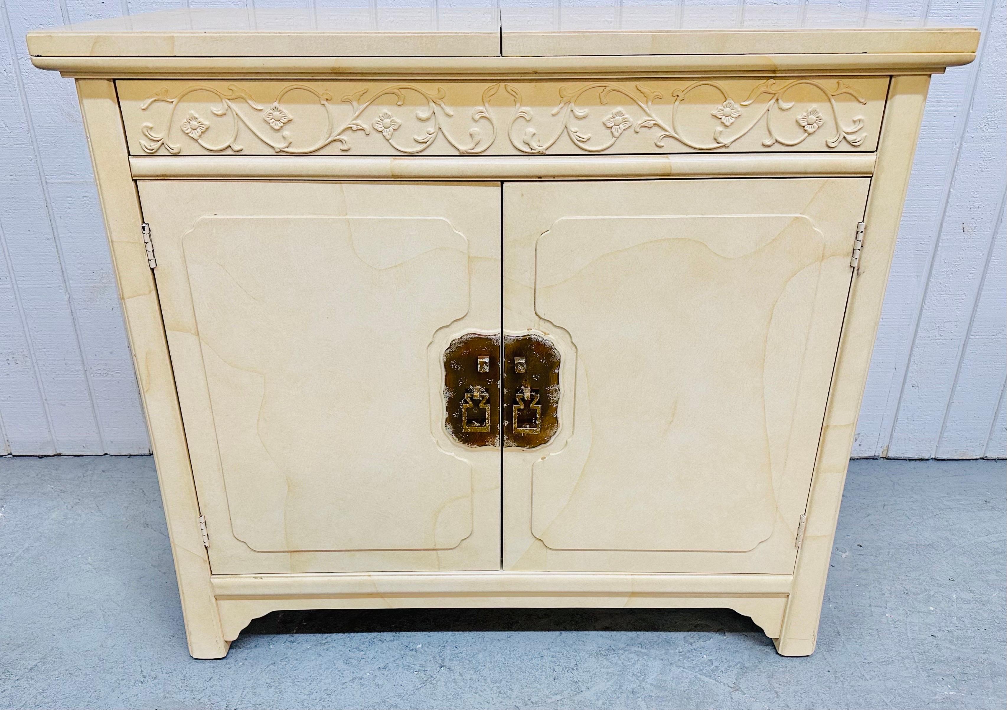 This listing is for a Vintage Henredon “Plan 2” Lacquered Bar Cabinet. Featuring a flip-top 76” L serving area, hidden push-to-open drawer, two doors that open up to storage space, original brass hardware, oriental inspired design, and a beautiful