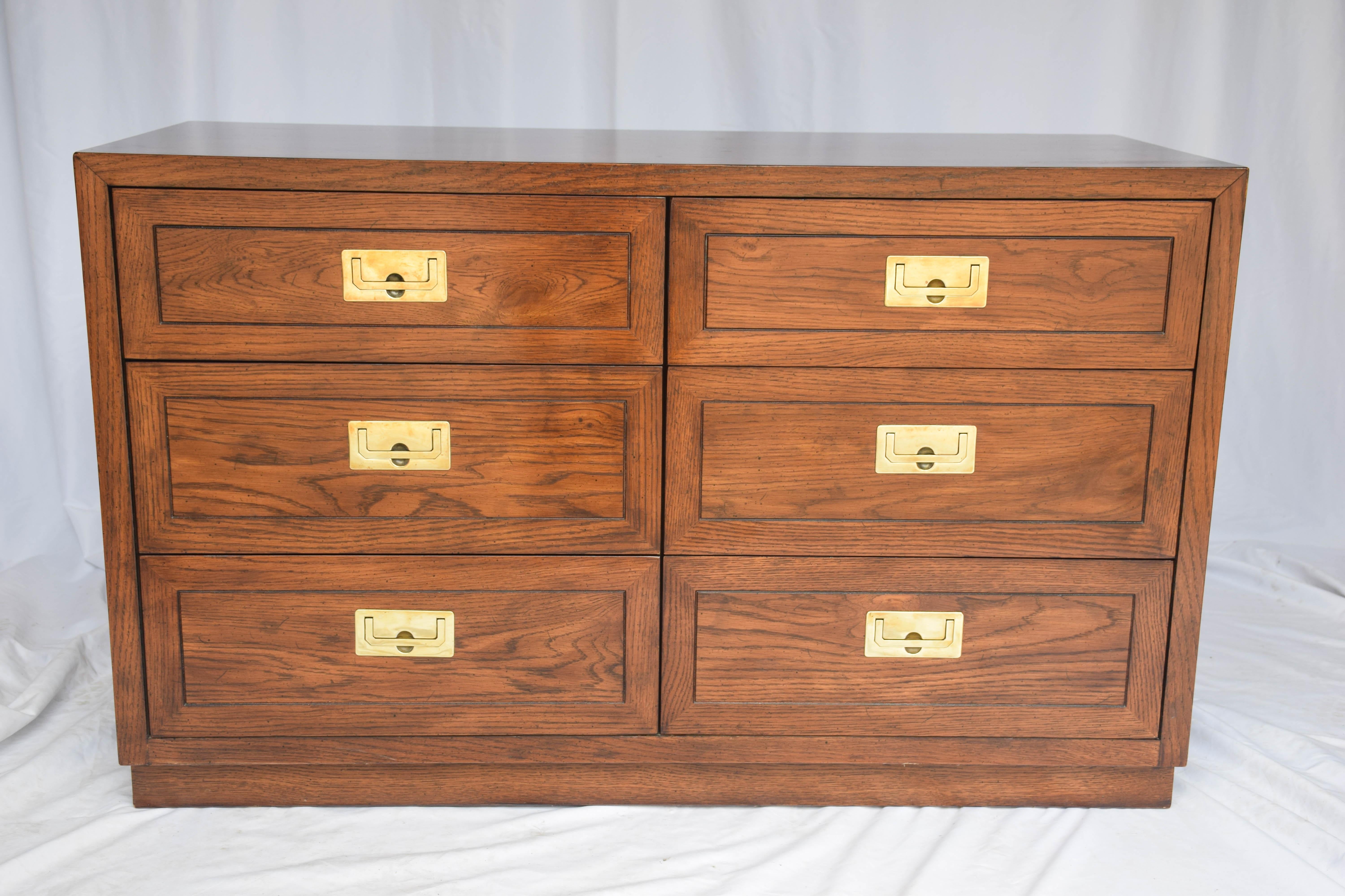 Vintage Campaign style chest of drawers by Henredon, Scene One collection. The chest six drawers fitted with brass pulls. One drawer interior is stamped “Henredon Fine Furniture.” A perfect piece to add Mid-Century Modern to your home or office.
 