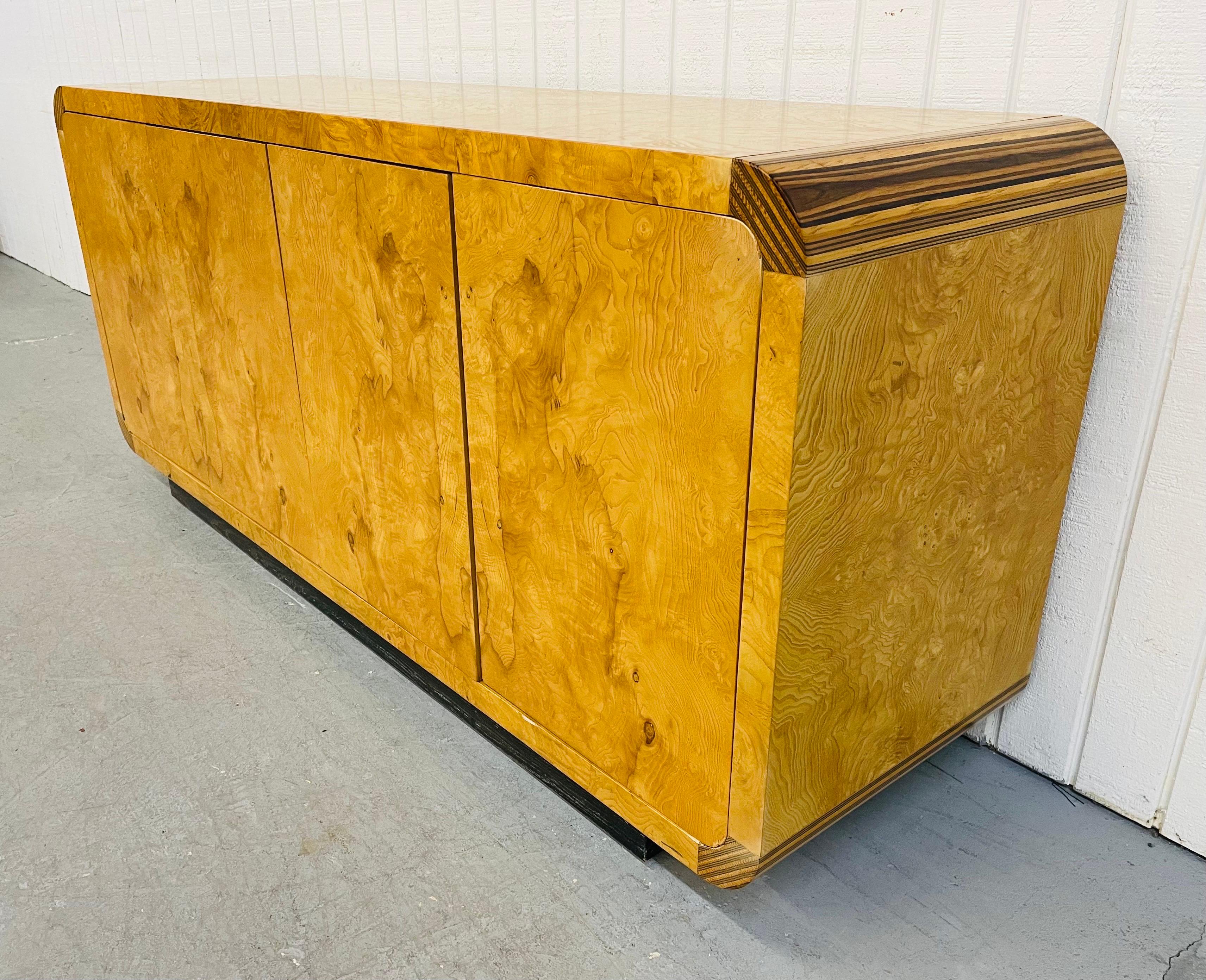 This listing is for a vintage Henredon scene-two burled wood sideboard. Featuring four doors that open up to a shelf and single drawer, a beautiful burled wood, and black base.