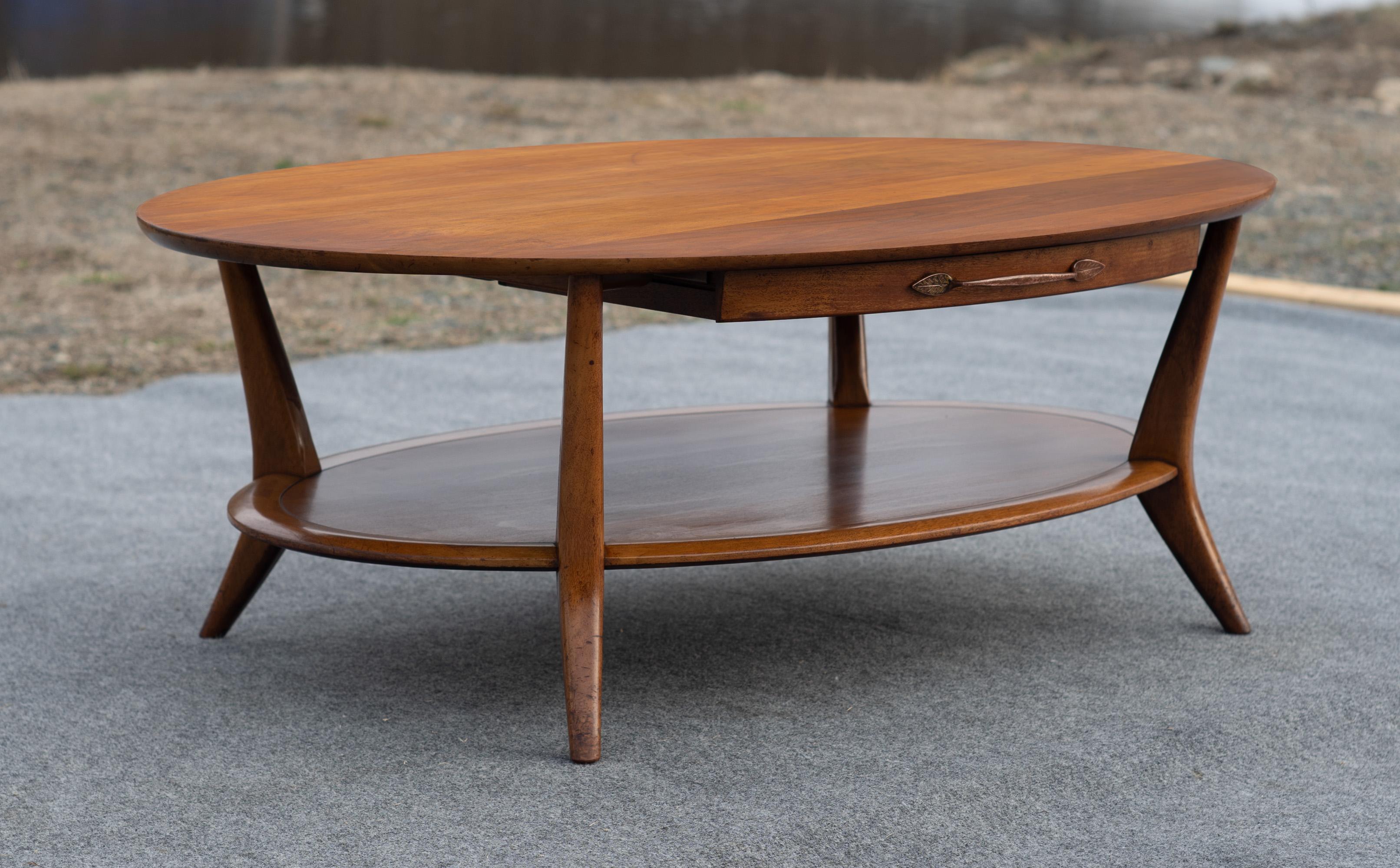Probably deisgned by esteemed architect Frank Lloyd Wright, this table was made by Henredon in the same era. Its design is reminiscent of some very limited production Wright designs toward the end of his life, and it's highly possible that Henredon