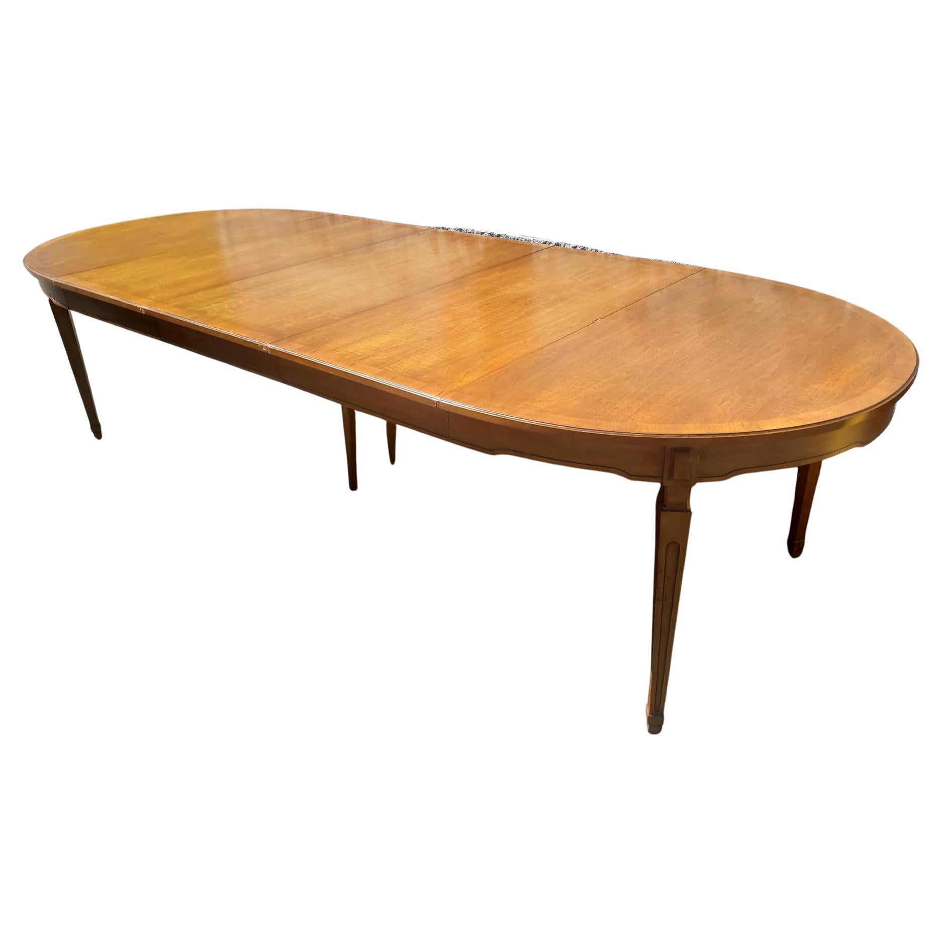 Vintage Henredon oval walnut dining table with banded top. For large or small dining area. Measures 117