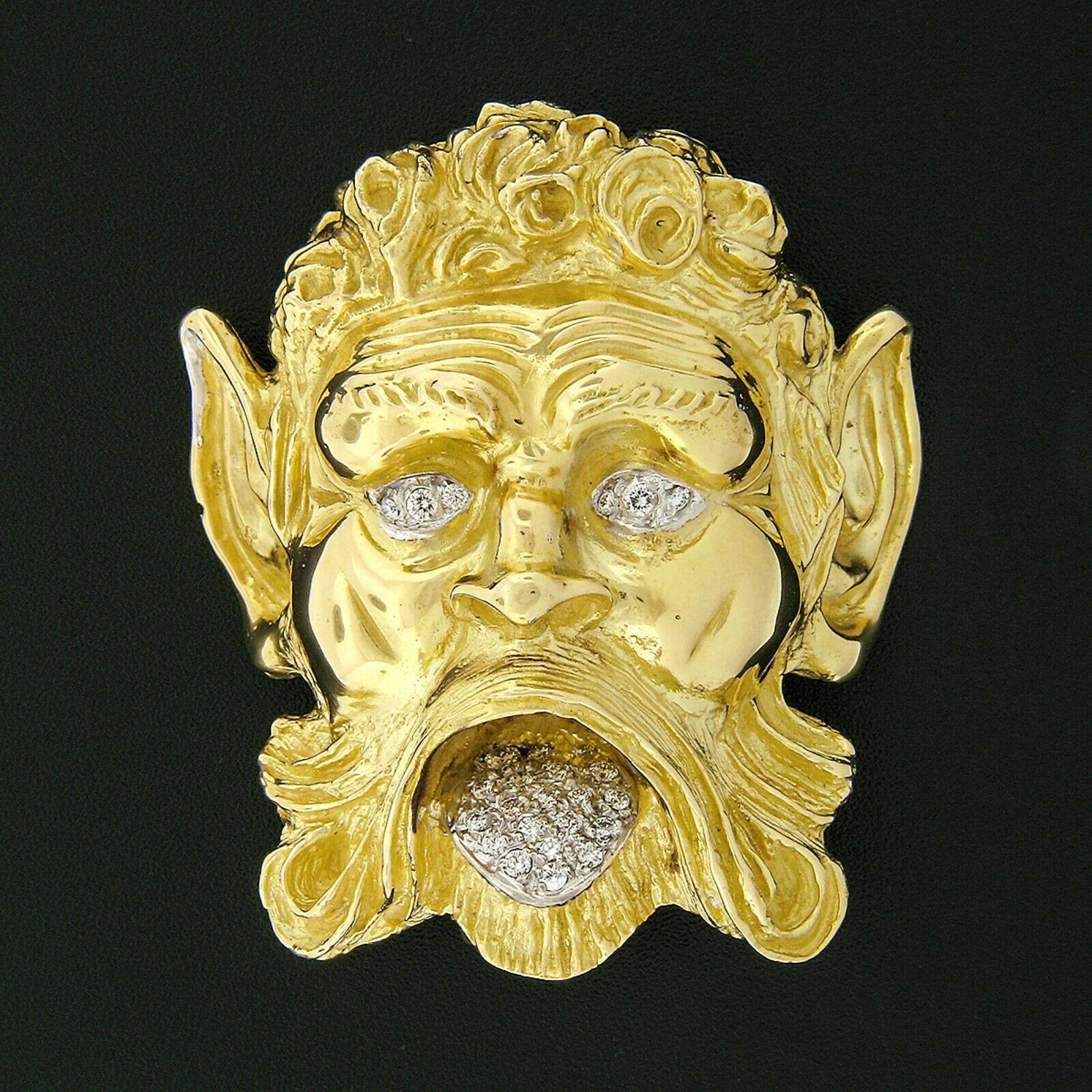 Here we have a very bold and large vintage brooch/pendant designed by Henry Dunay and solidly crafted in 18k yellow gold. The large brooch features a very well detailed Poseidon's head design from Greek Mythology, adorned with super fine quality