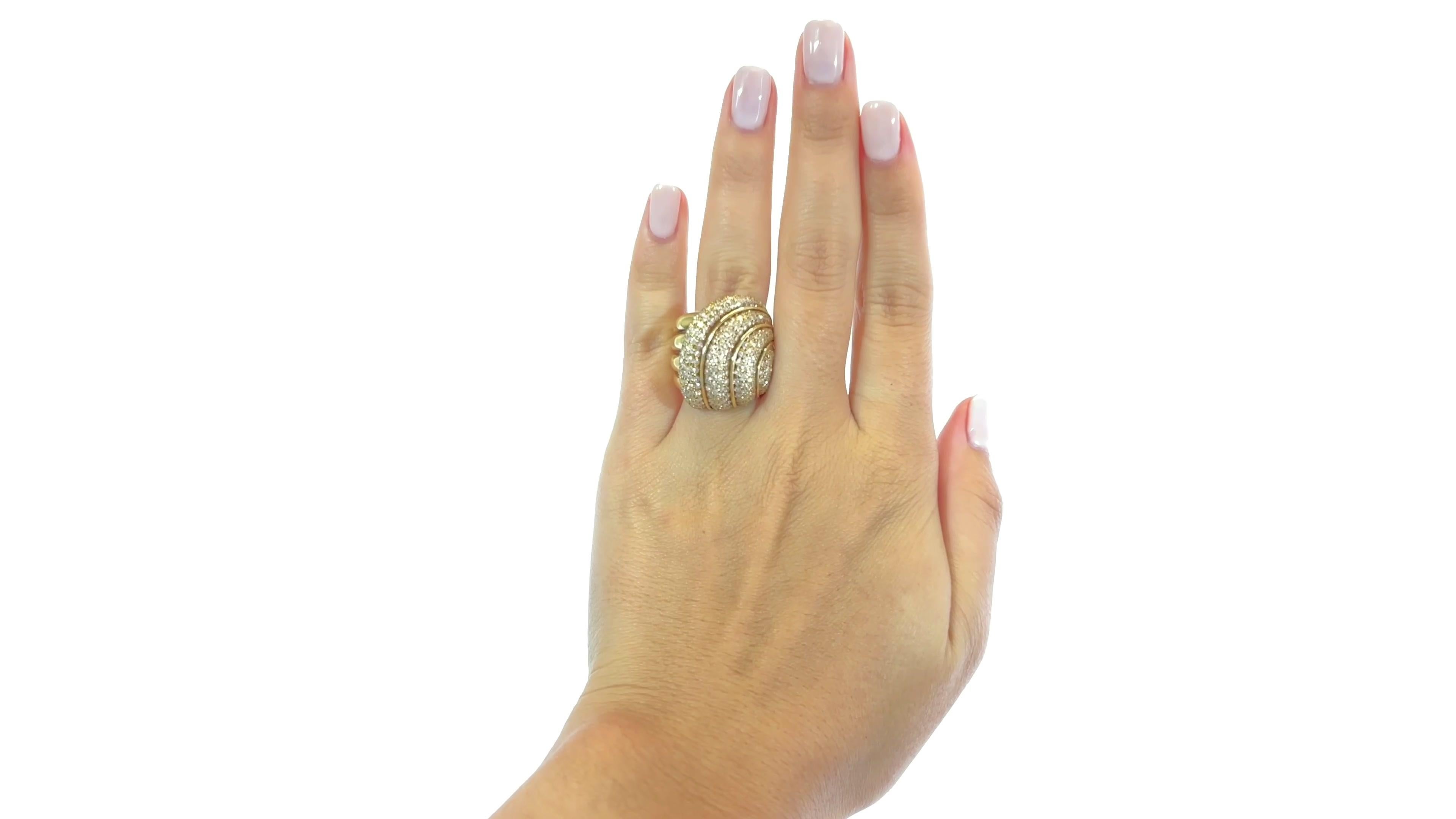 Vintage Henry Dunay Diamond Gold Cocktail Ring. This ring is adorned with many Round Brilliant Cut diamonds approximately 3.00 carats total, D-E color, VVS clarity. Signed Dunay, with purity mark. Circa 1980s. Size 6 1/2.

About The Piece: When it