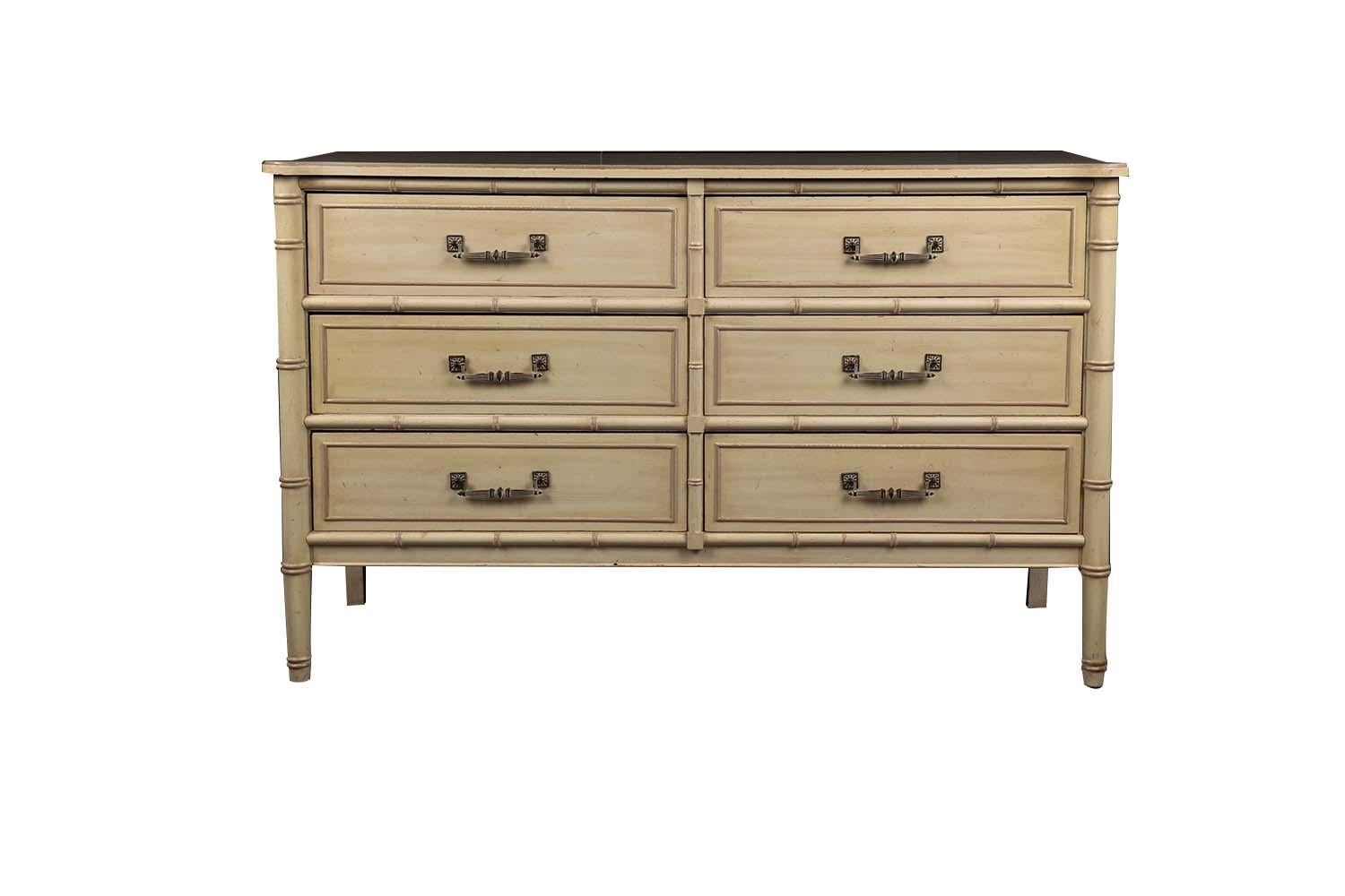 Attractive vintage six drawer faux bamboo dresser circa 1960s. Crafted by the Henry Link Trading Co. from the Bali Hai collection. This dresser features water-resistant laminate top above classic Bali Hai design elements such as faux bamboo and