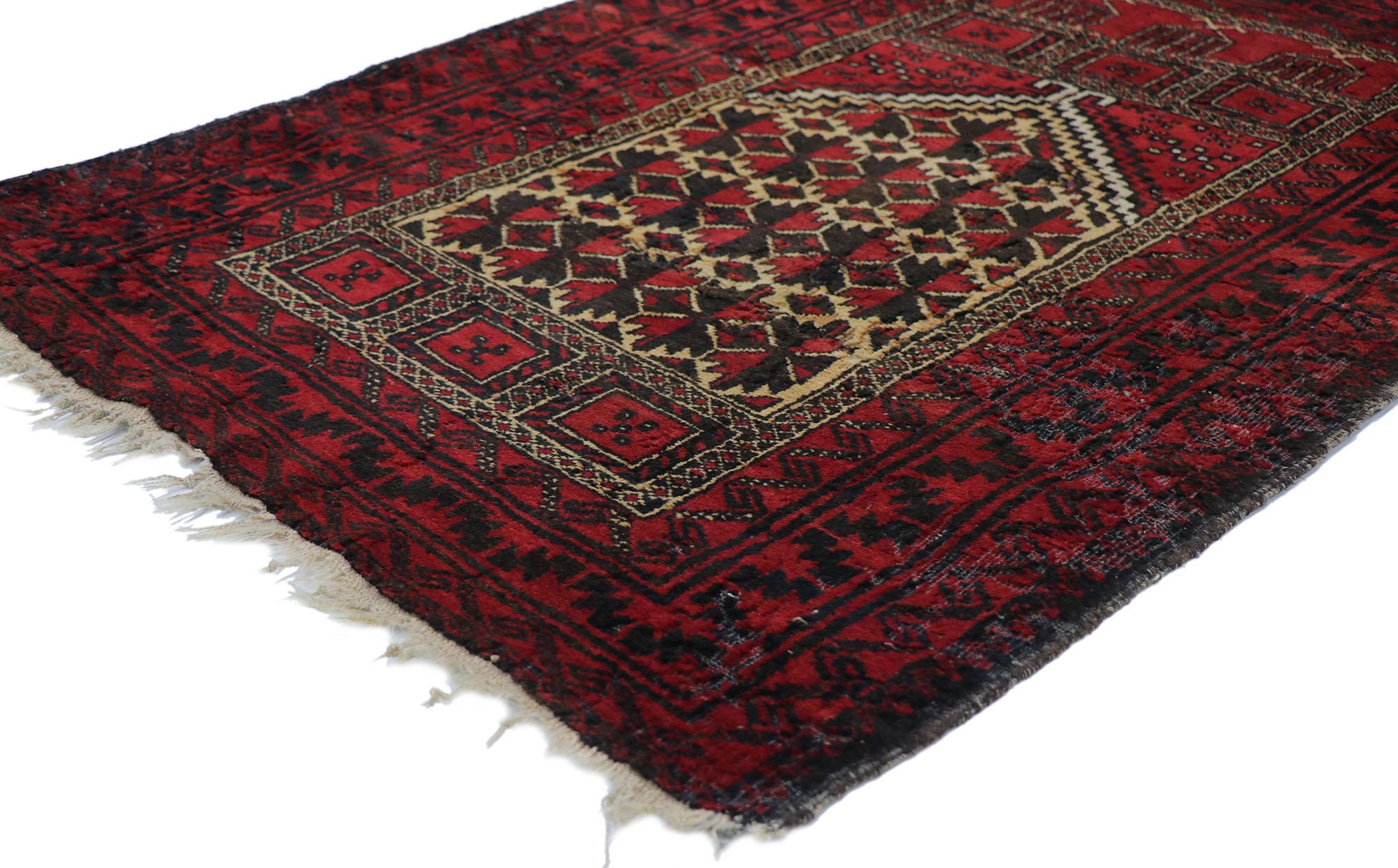77785 Distressed Vintage Herat Persian Baluch Prayer rug 03'00 x 04'00. With warm hues and rugged beauty, this hand knotted wool distressed vintage Persian Baluch prayer rug beautifully embodies rustic tribal style. It features a stepped mihrab