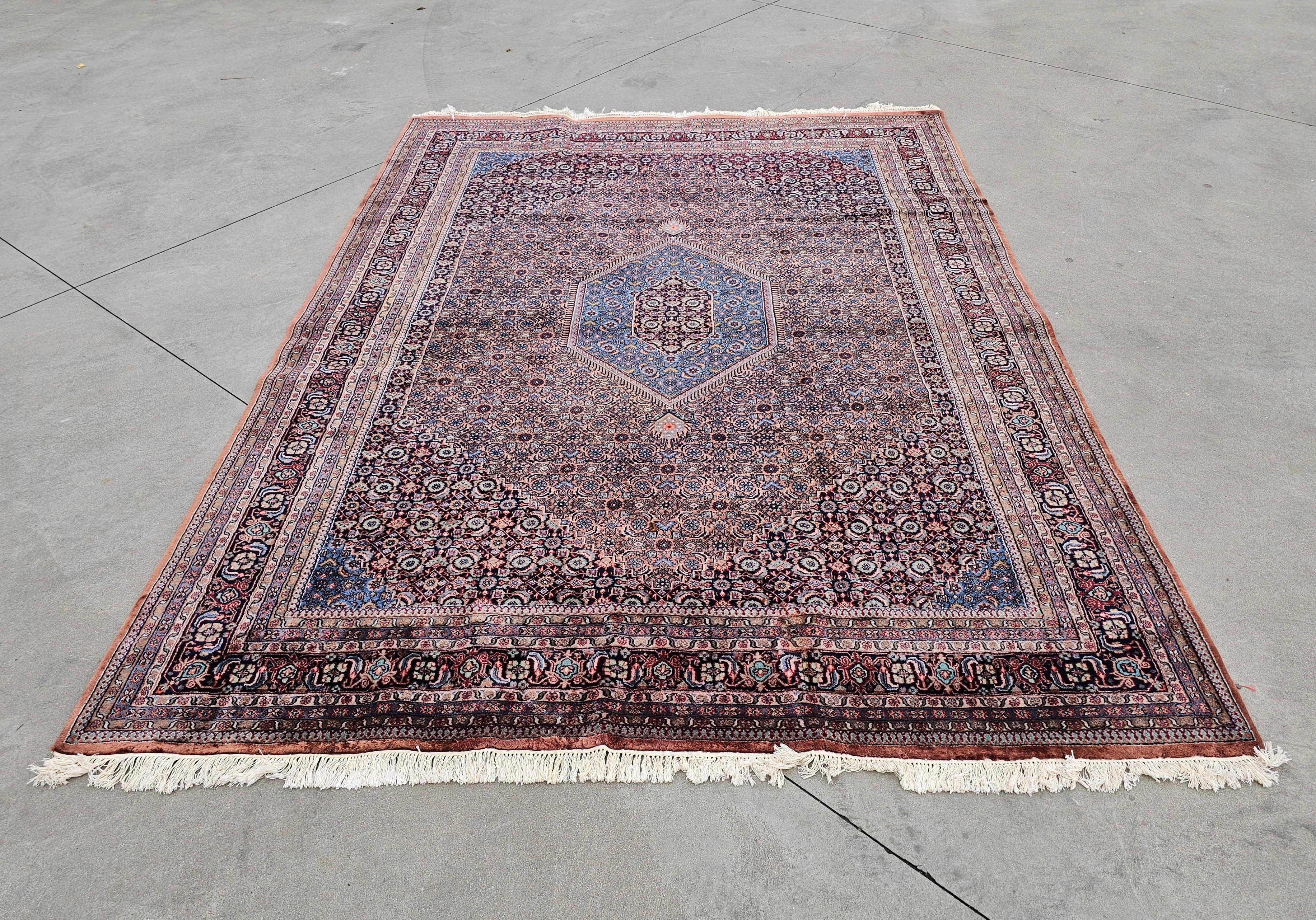 In this listing you will find an extra large Hand-knotted Herati Bidjar area rug. The rug is made of 100% wool and it is still in very good and fluffy condition. It features beautiful, calming colours with gorgeous patterns.  Made in India in