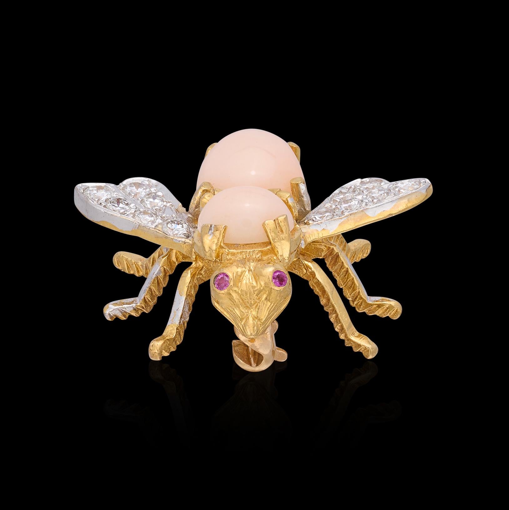 This 18k gold bee brooch, by Rosenthal - one of the best of the 1970's  - is a hard-to-find coral example. Designed with angel skin coral body, wings set with 12 round brilliant-cut diamonds, G-H/VS, weighing an estimated 0.40-cts, and accented with