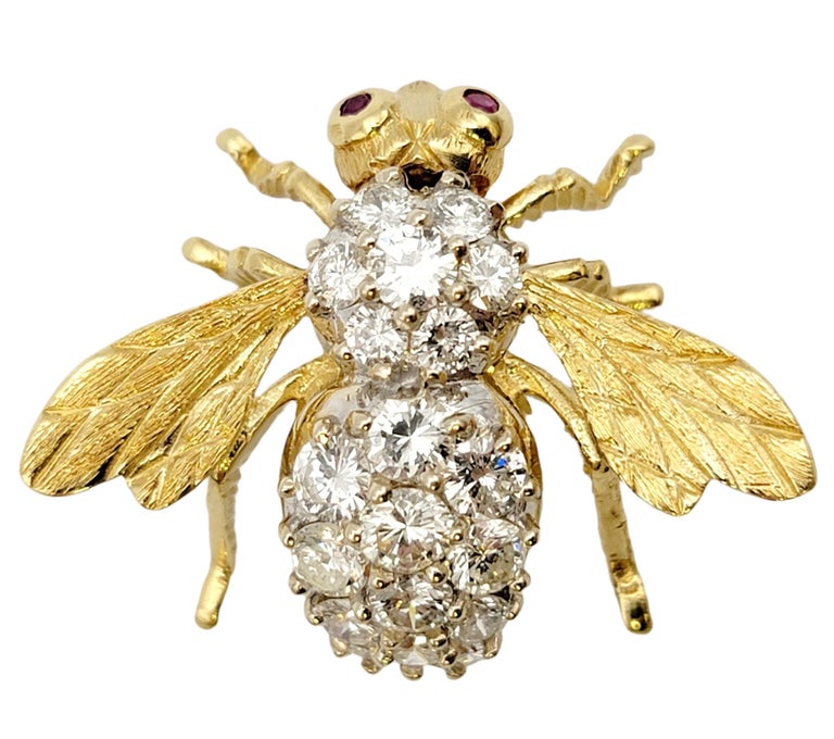 Beautifully detailed bee brooch accented with glittering diamonds and ruby accents. Made of solid 18 karat yellow gold, this exquisite vintage piece by Herbert Rosenthal is a work of art and a fantastic conversation piece. 2 natural red rubies act