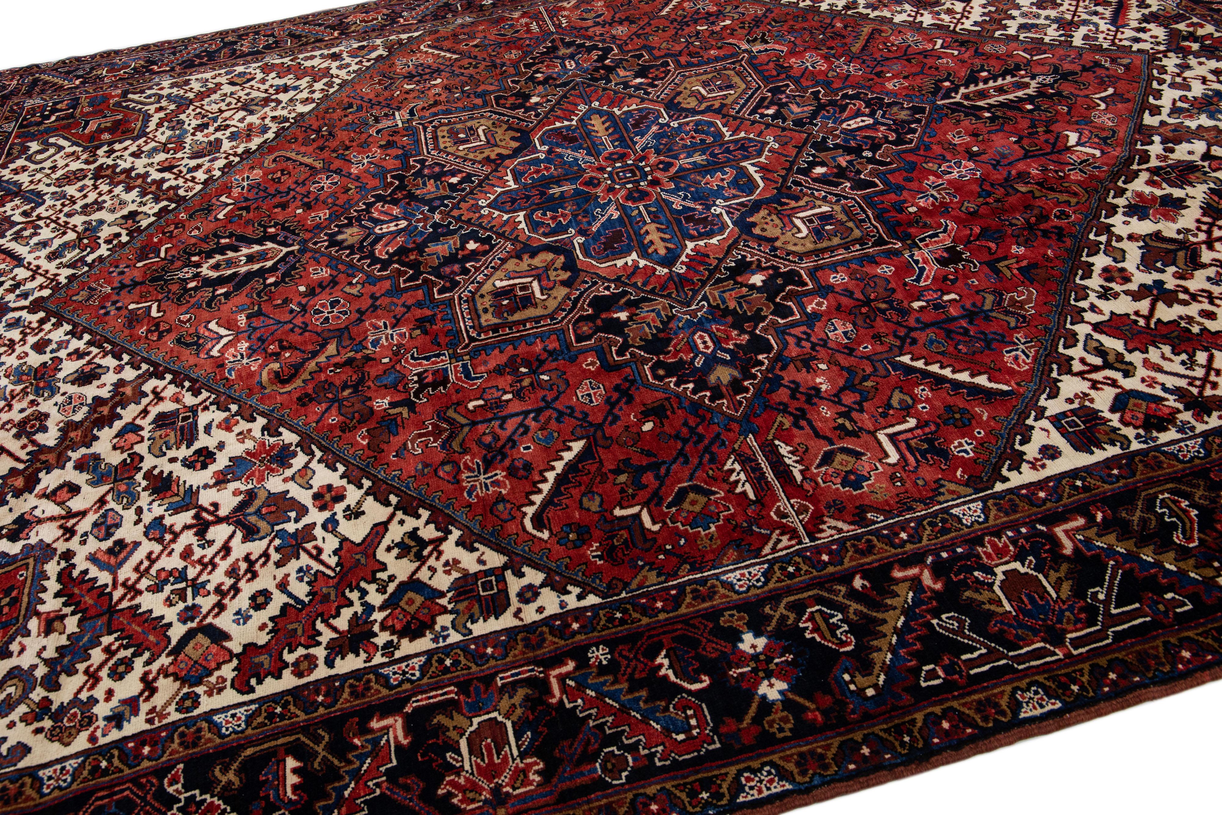 Vintage Heriz Handmade Medallion Motif Red Wool Rug In Good Condition For Sale In Norwalk, CT