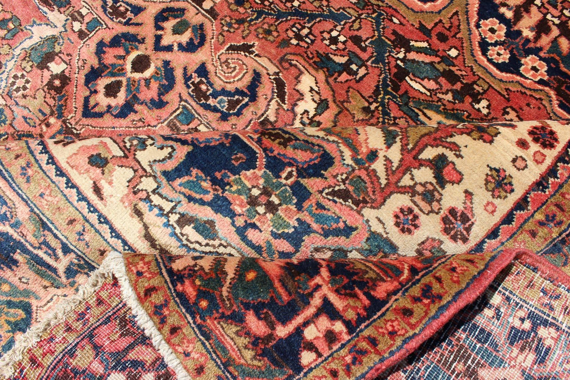 Hand-Knotted Semi Antique Heriz Persian Rug with Geometric Medallion in Rust and Blue