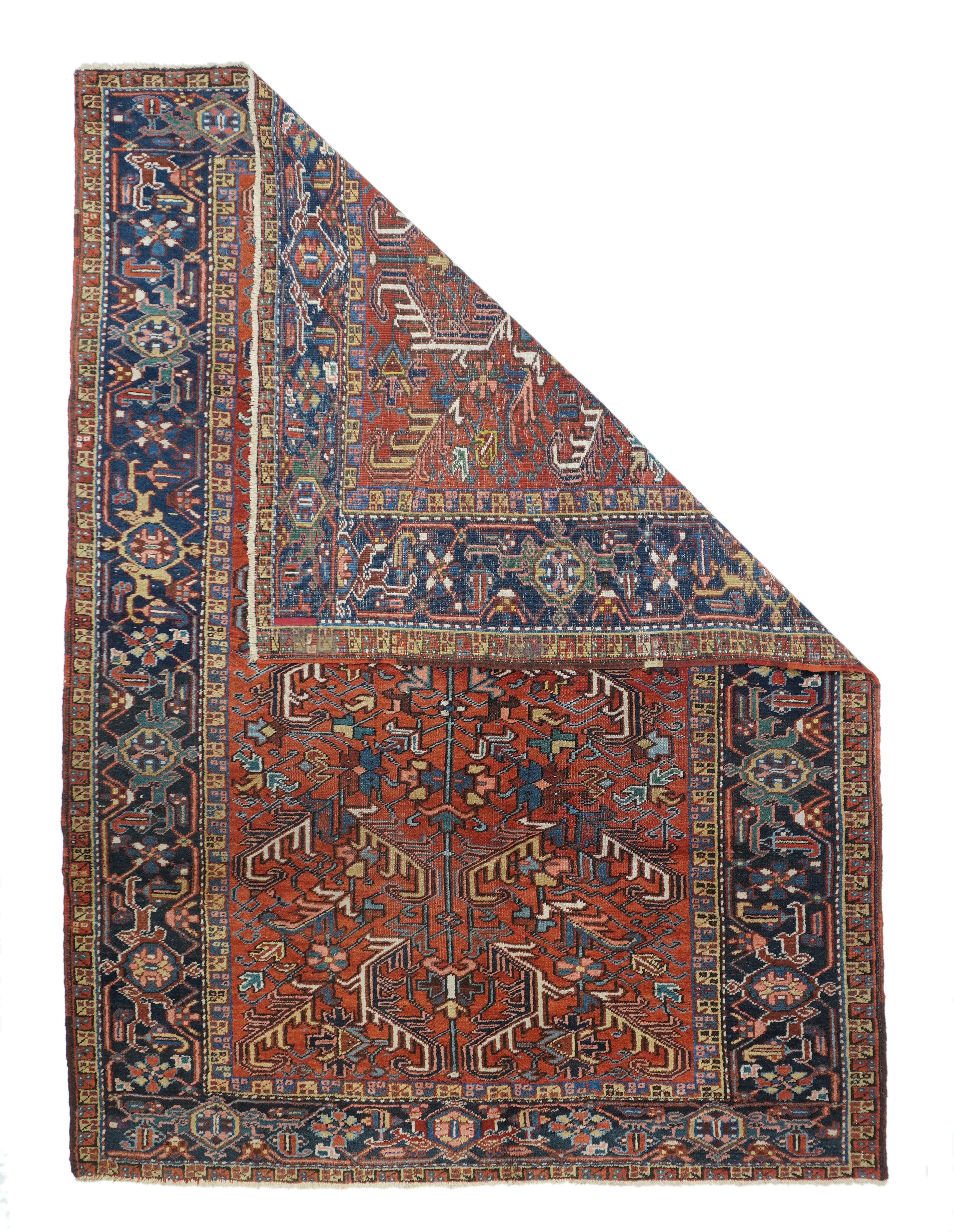 Vintage Heriz rug 6'2'' x 8'9''. Lots of bent bitonal leaves here, with straw mustard and ecru details, and a central multi-petal fringed octagon. Rust-red field shows small areas of slight wear. Touches of dark blue, dark red and teal. Charcoal