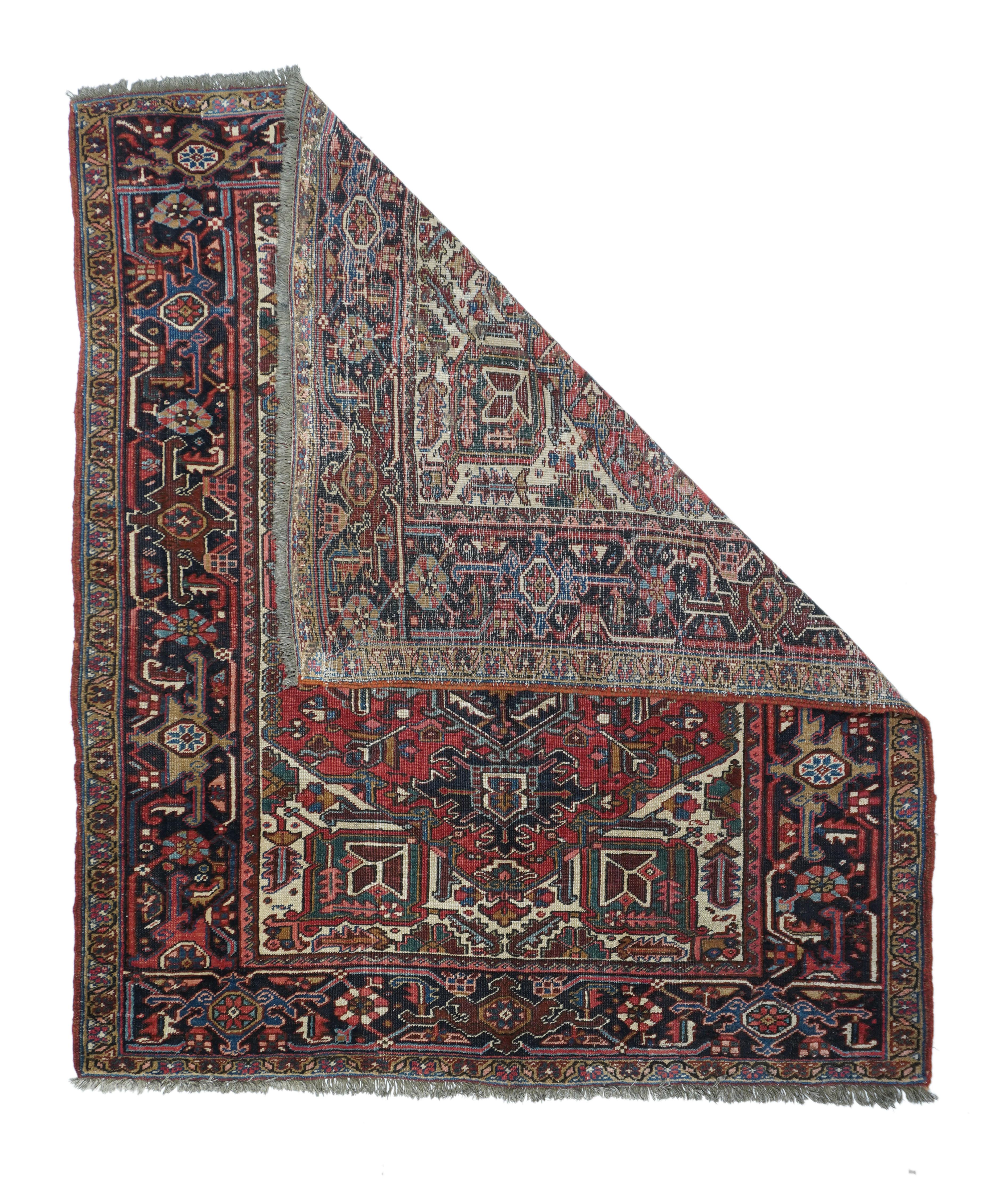 Vintage Heriz Rug 6'3'' x 7'7''. A rare size for this NW Persian rustic type. The ivory field develops into triangular corners, tying into the red subfield with large, squared pendants enclosing flowers. Navy medallion, cream octogramme