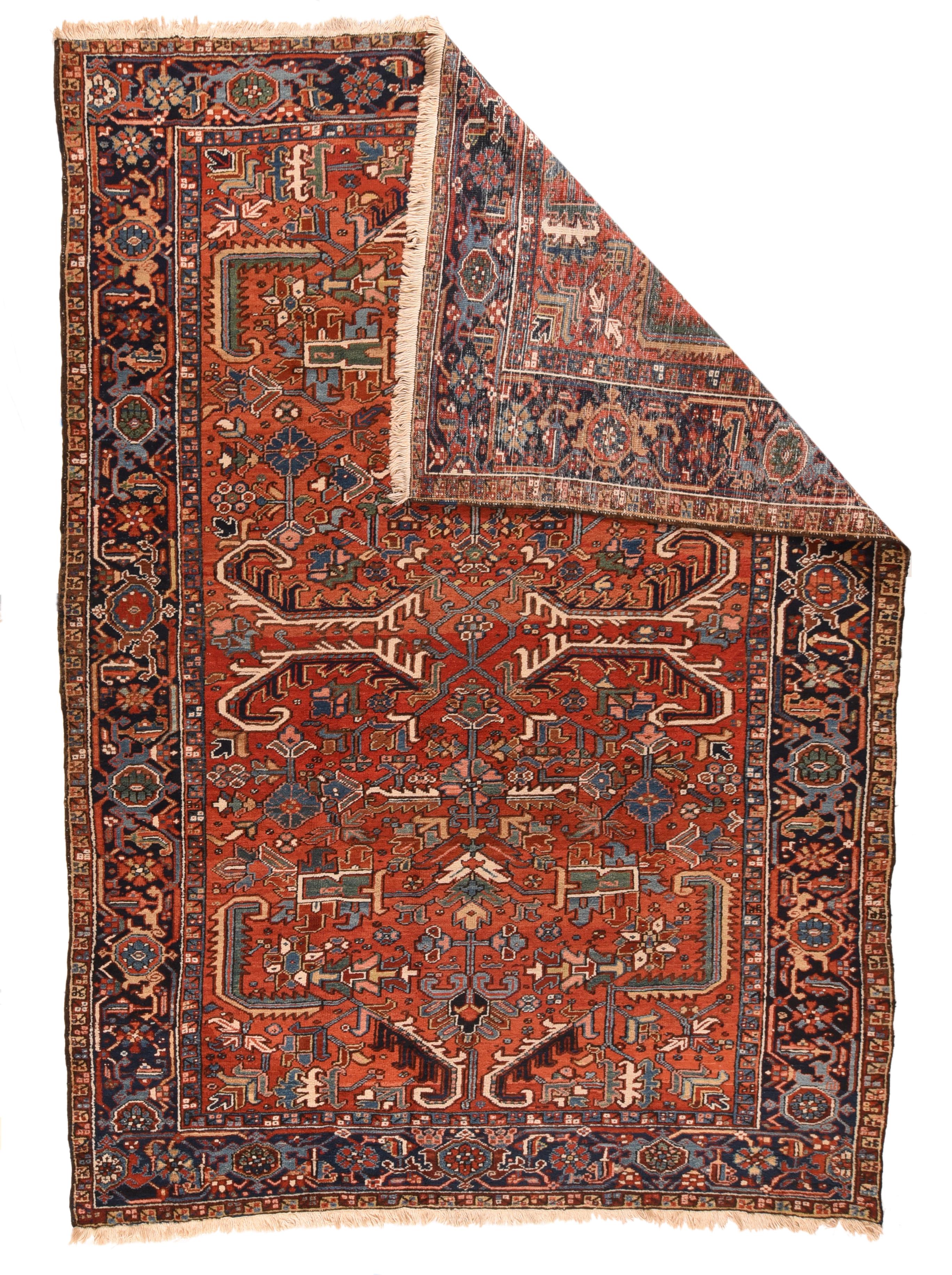 Vintage Heriz rug 7'5'' x 10'3''. Characteristically Mehriban, with a medium-coarse rustic weave on cotton, and pairs of biochromatic semi-geometric curled leaves; two pairs in the centre and a pair at each end of the visibly abrashed warm madder