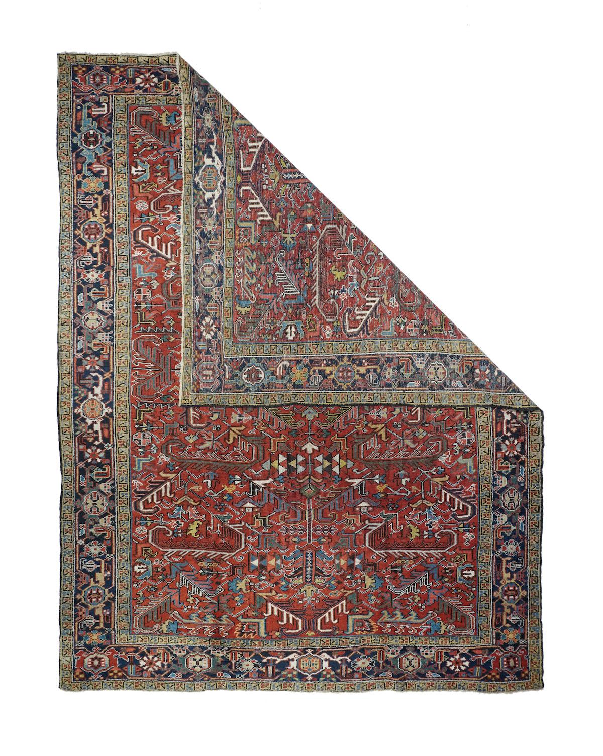 Vintage Heriz rug¬†7'5'' x 11'. Red field, overall patterns with large barbed or fringed leaves and an under 7' by 10' size are characteristic of Mehriban/Heriz Interwar carpets. This example with a cotton foundation and medium-coarse weave is