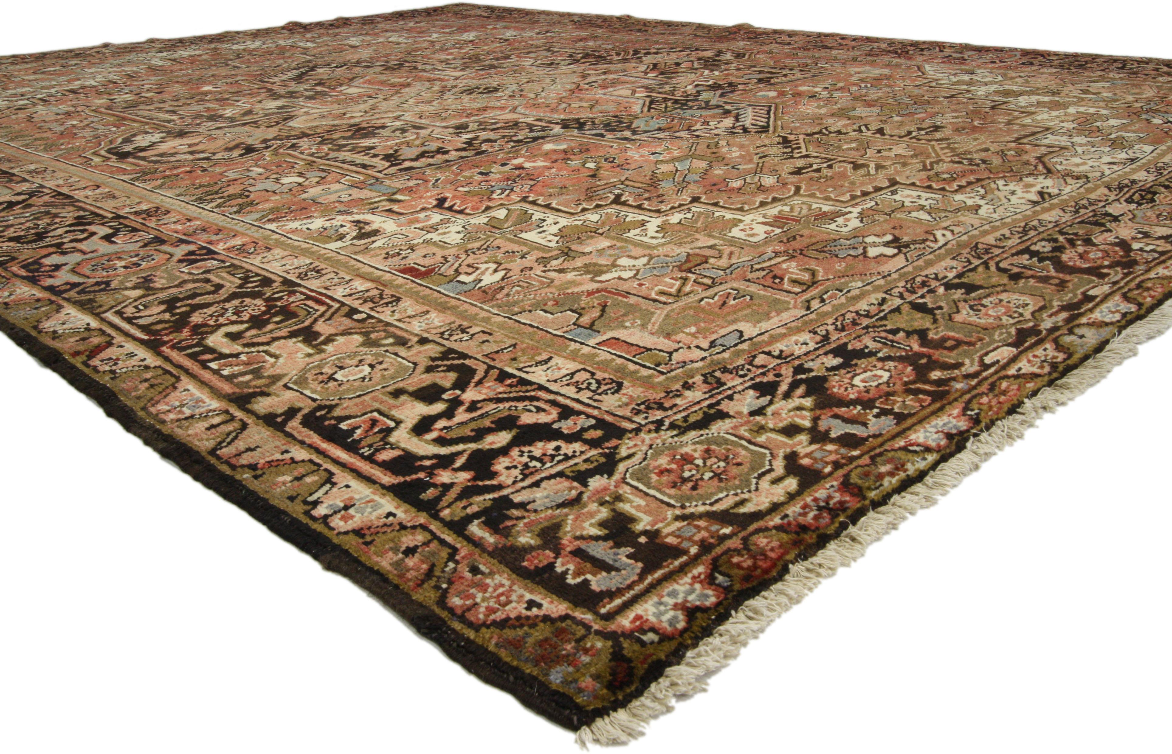 73720, vintage Heriz rug with Luxe style and warm, rustic colors. With timeless appeal, refined colors, and architectural design elements, this hand knotted wool vintage Persian Heriz rug can beautifully blend contemporary and traditional interiors.