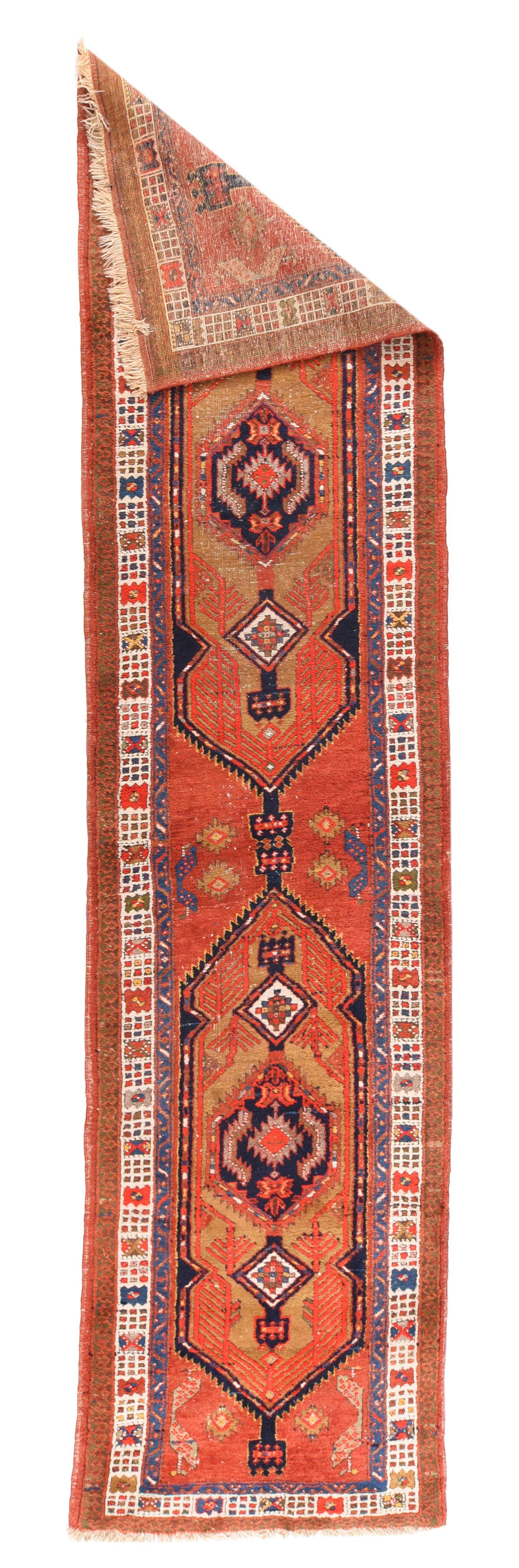 Vintage Heriz Runner 2'8'' x 11'8''. Heriz are one of the most unchanging of rustic Persian rugs, both in the general camel-tone palette and in the design of cartouche-format subfields with, pendanted have hexagonal medallions. Here we have a two