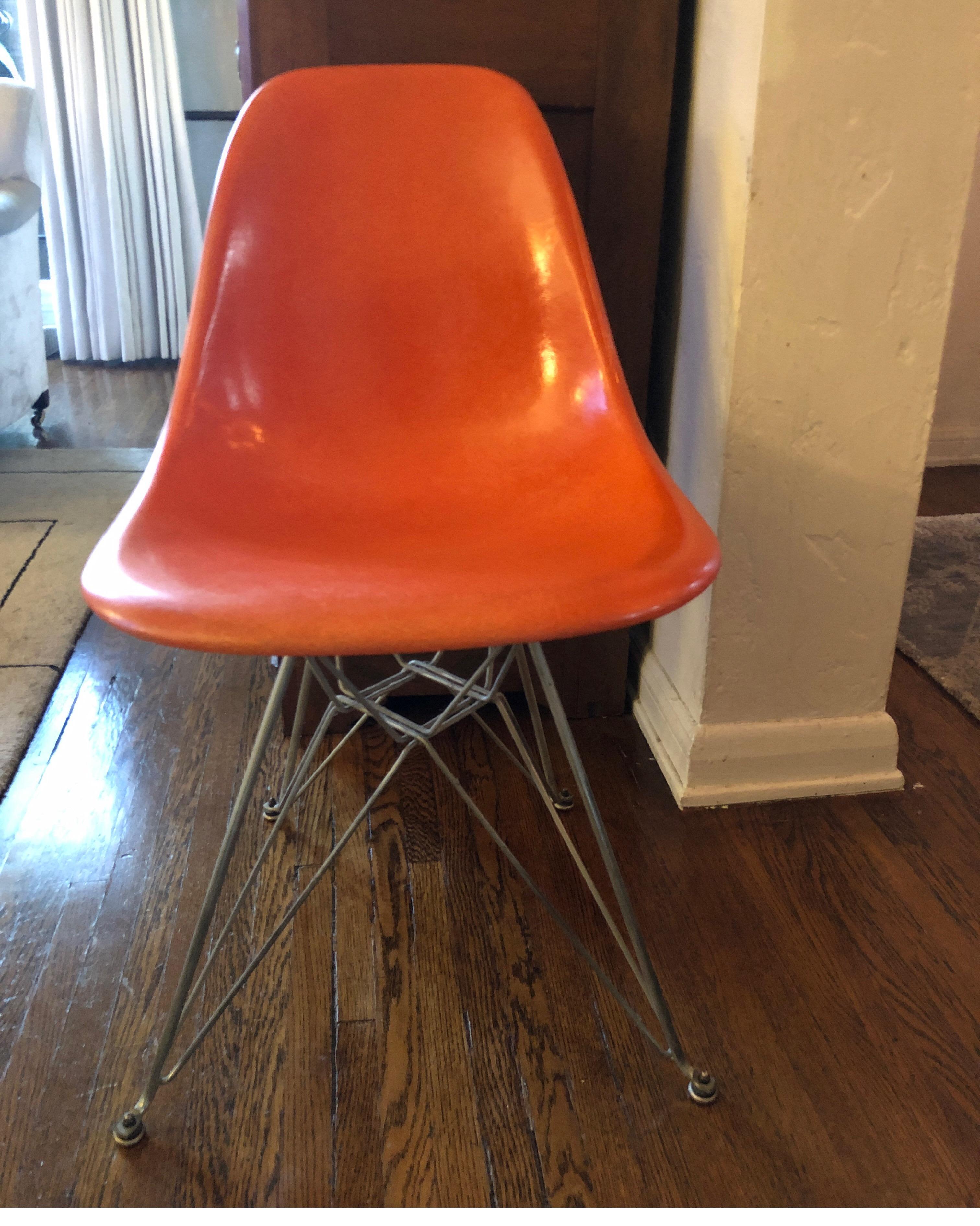 Vintage Herman Miller fiberglass shell chair. 
Burnt orange with original steel base. 

1970s

No stress cracks. Great condition consistent with age.