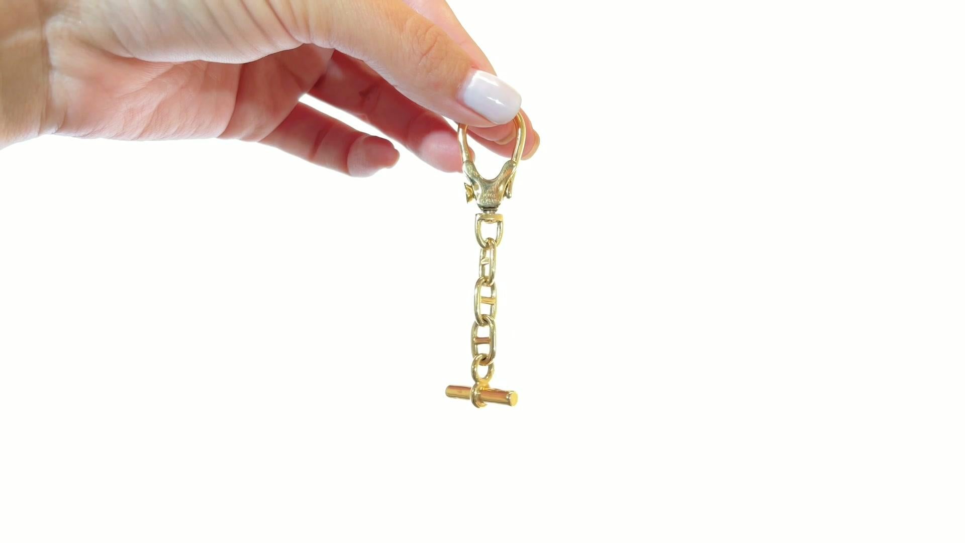 Vintage Hermes 18 Karat Gold Key Chain. Signed Hermes Paris. Circa 1960s. The length is 3 inches. 

About The Piece: Feel luxurious and important in every way. Own a piece of luxury made by this iconic designer. 

Flawless Protection Plan: 
-7-day
