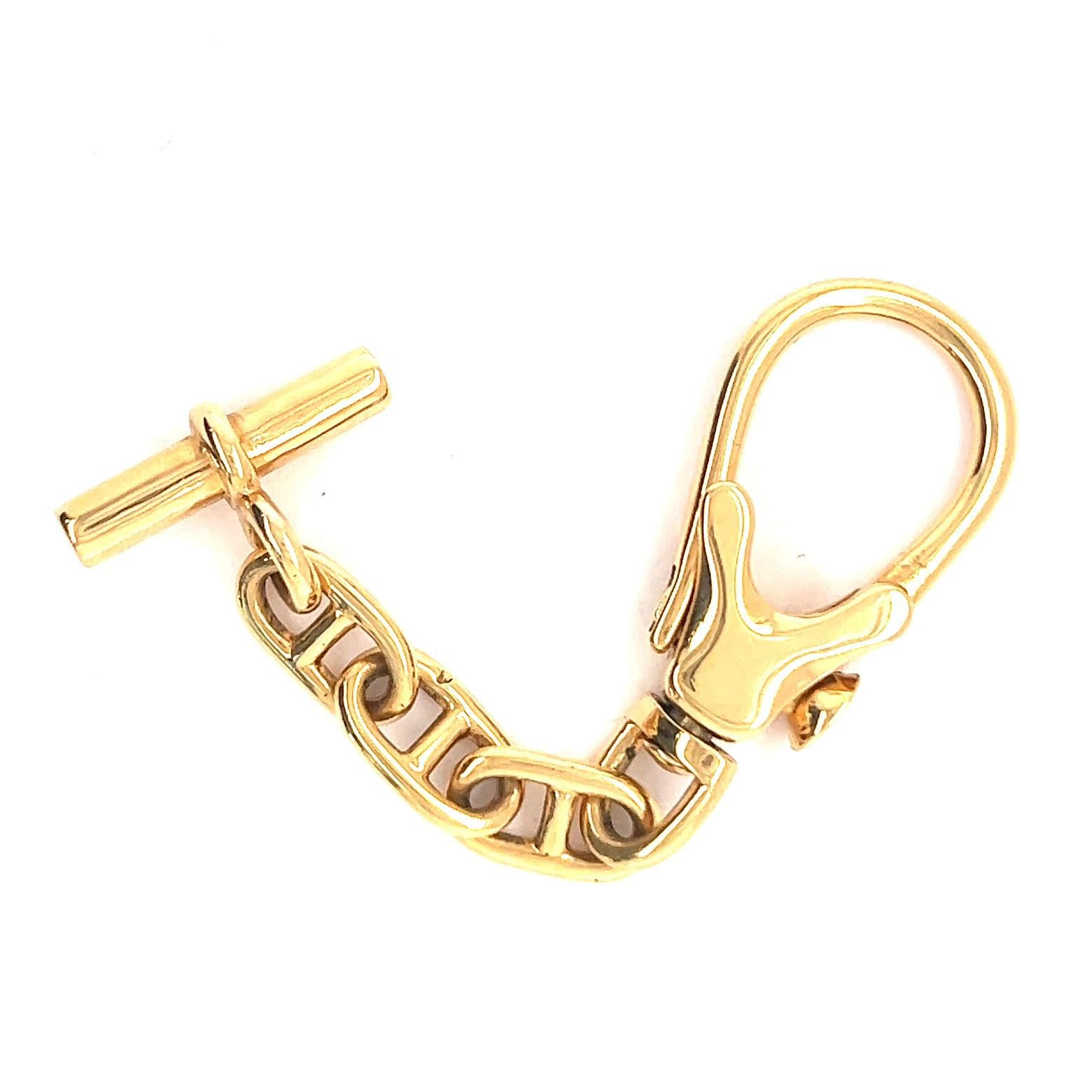 One Vintage Hermes 18 Karat Gold Key Chain. Crafted in 18 karat yellow gold, signed Hermes Paris. Circa 1960s. The keychain measures 3 inches in length. 

About this Item: This Vintage Hermes Gold Key Chain is a classic must-have to add