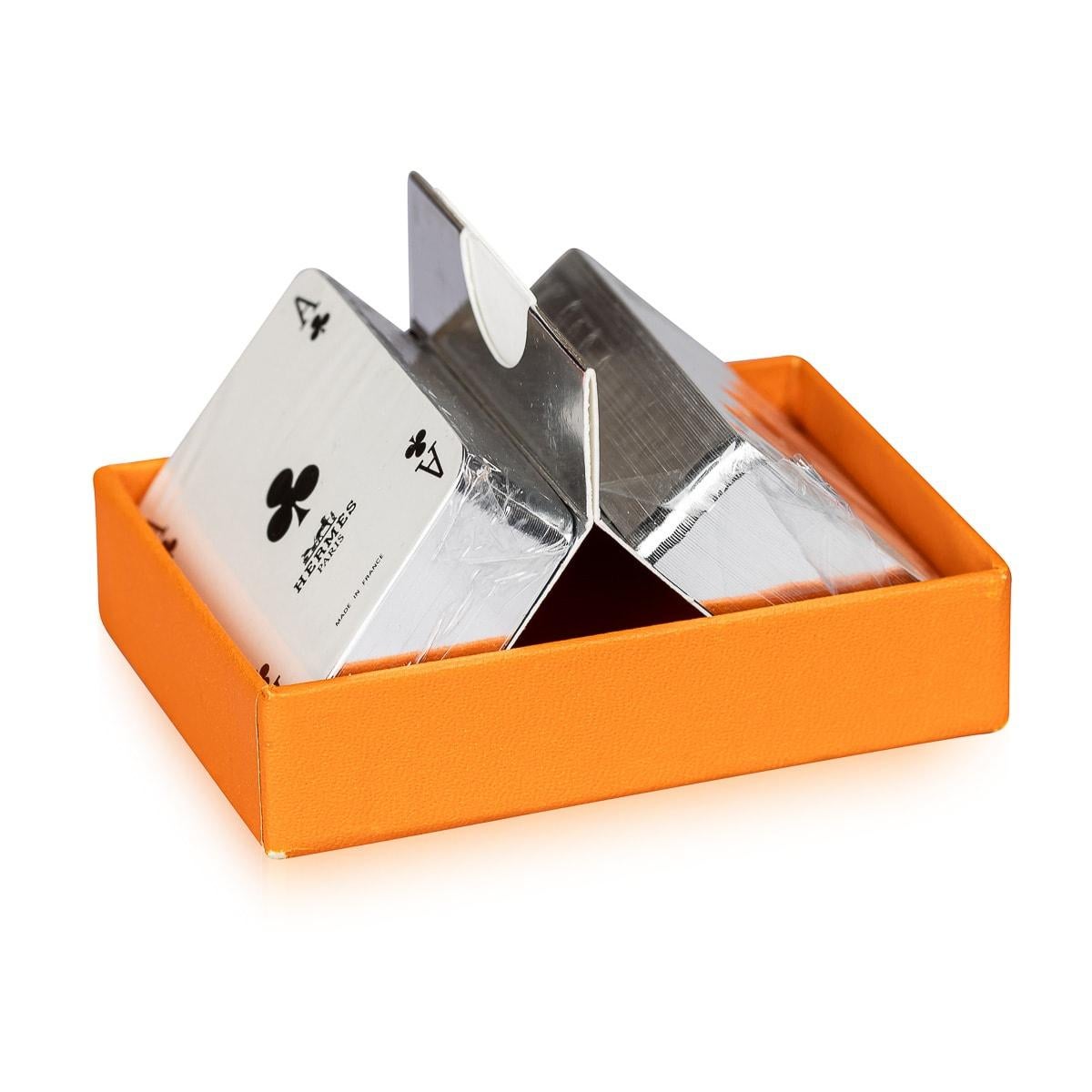 Vintage set of 2 Hermes silver edged playing cards, accented with silver edges. Adorned with the iconic Hermes 
