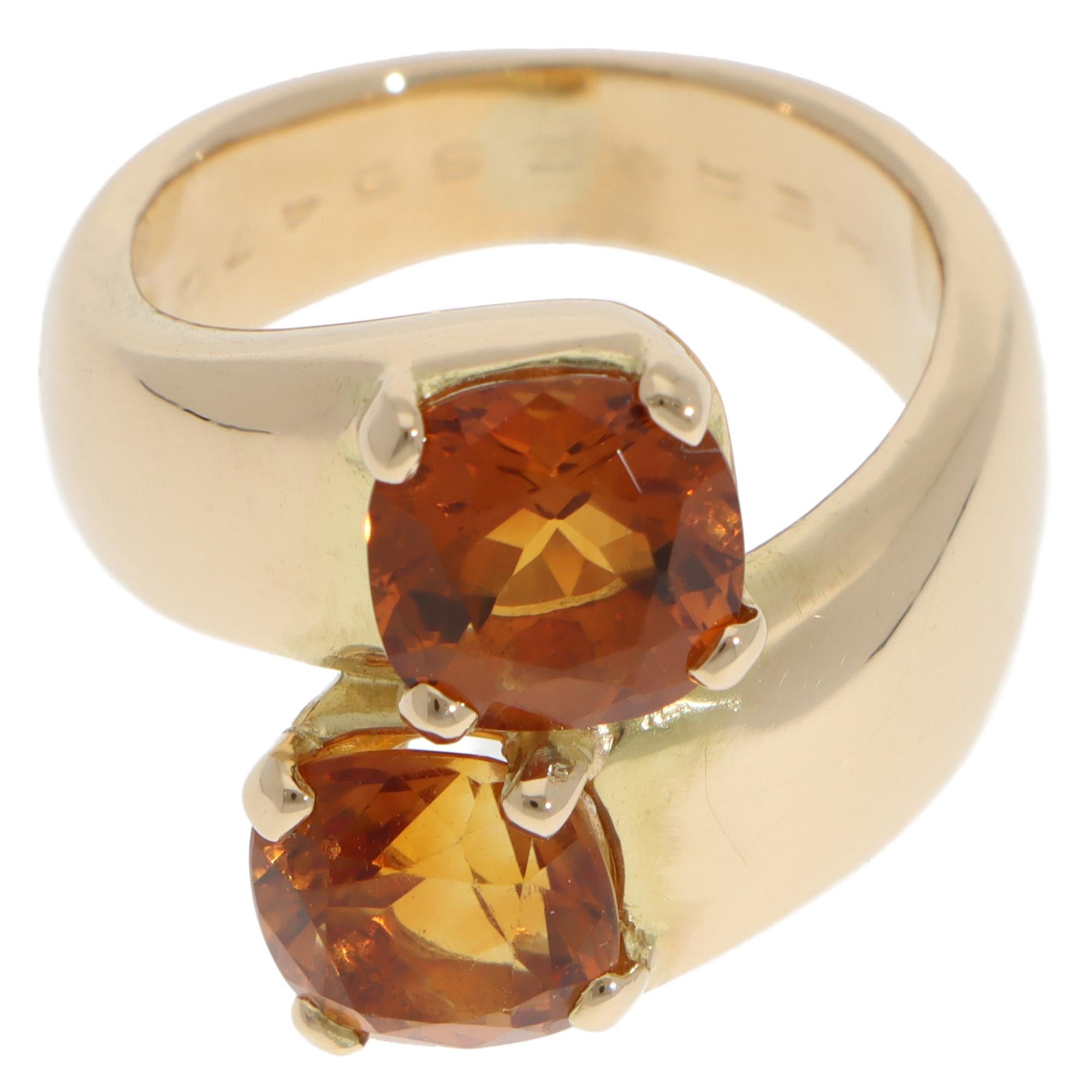 A beautiful vintage Hermès citrine bypass ring set in 18k yellow gold.

From the Hermès discontinued collection, the ring is composed of 2 large cushion mixed-cut citrines. The citrines are four-prong set in polished yellow gold with a stylish