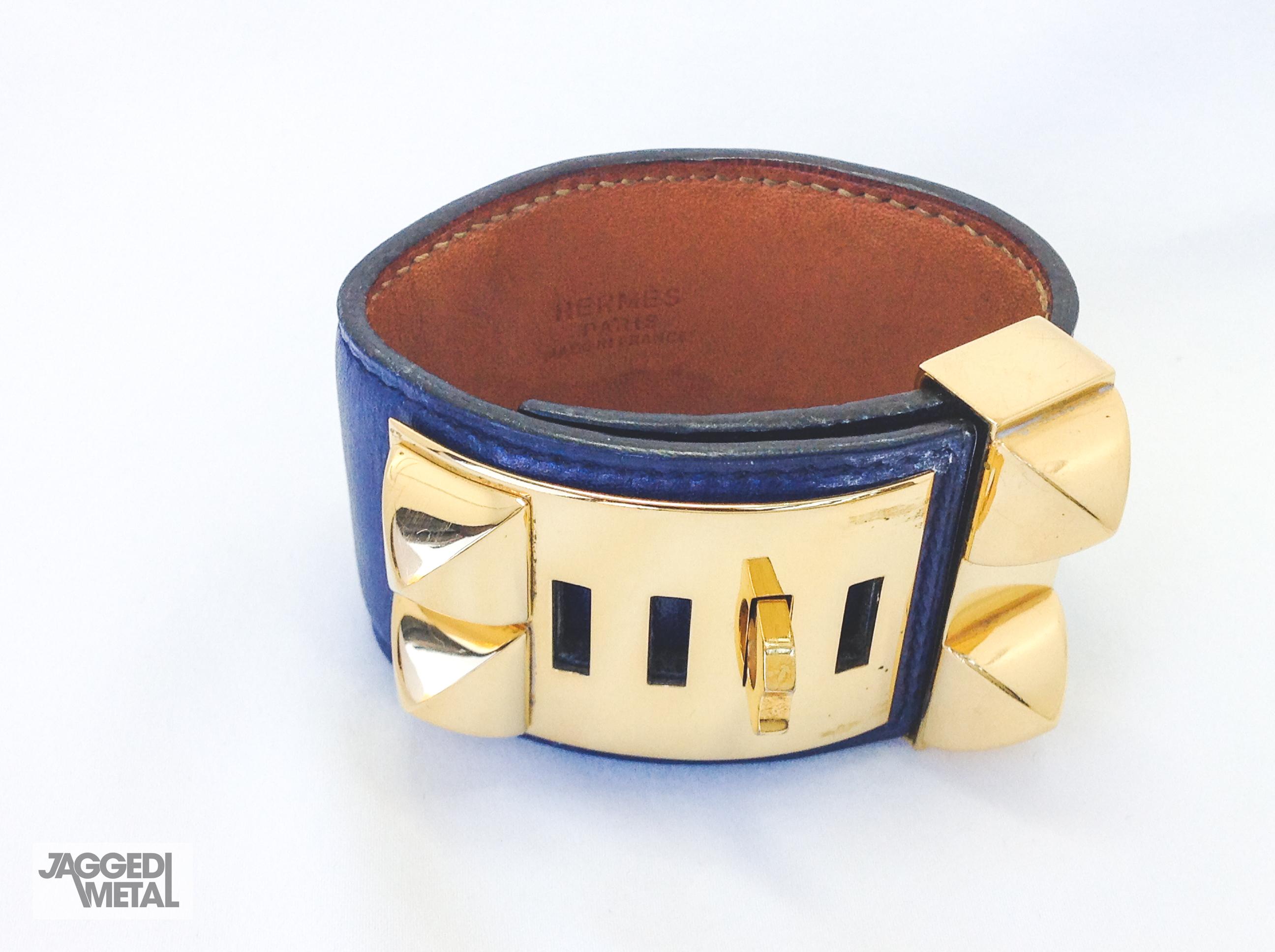 Vintage HERMÈS Collier De Chien Cuff Bracelet 

Blue leather with gold plated studs and ring. Adjustable slide lock closure. 

Size & Fit
-length 21 cms, width 4 cms 

Authenticity & Condition
Fully examined and authenticated by experts. This is a