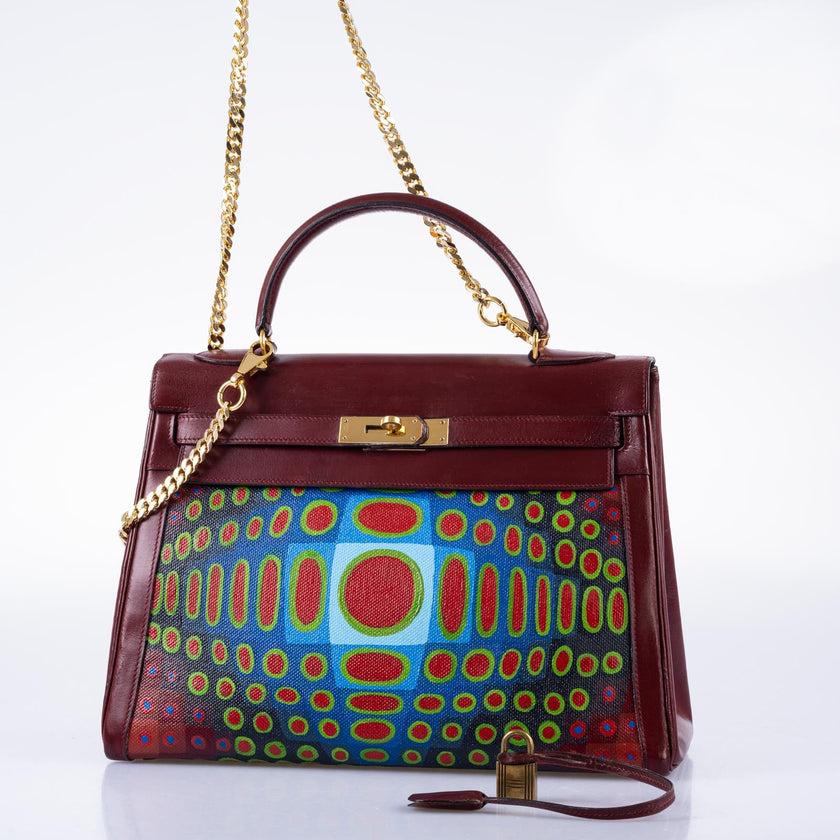 Vintage Hermès Custom Painted ‘Cyber Croc’ Kelly 32 Rouge H Box with Gold Hardware

The intricate and bold geometric patterns of the digital crocodile skin are brought to life with a vibrant color palette, featuring shades of blues, greens, and
