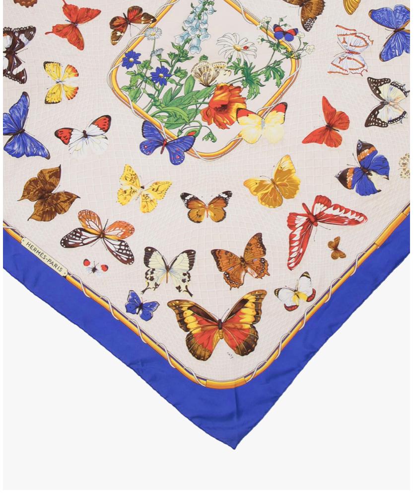 Vintage Hermes “Farandole Butterflies” Scarf designed by Caty Latham featuring a medley of various butterflies in blue edging.
Hand-Rolled edges.
Year: 1992
Composition: 100% silk
Size: 90*90cm
Condition: Very Good. Light signs of wear throughout.