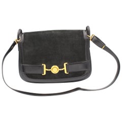 Vintage Hermès handbga with shoulder strap in black leather and suede.