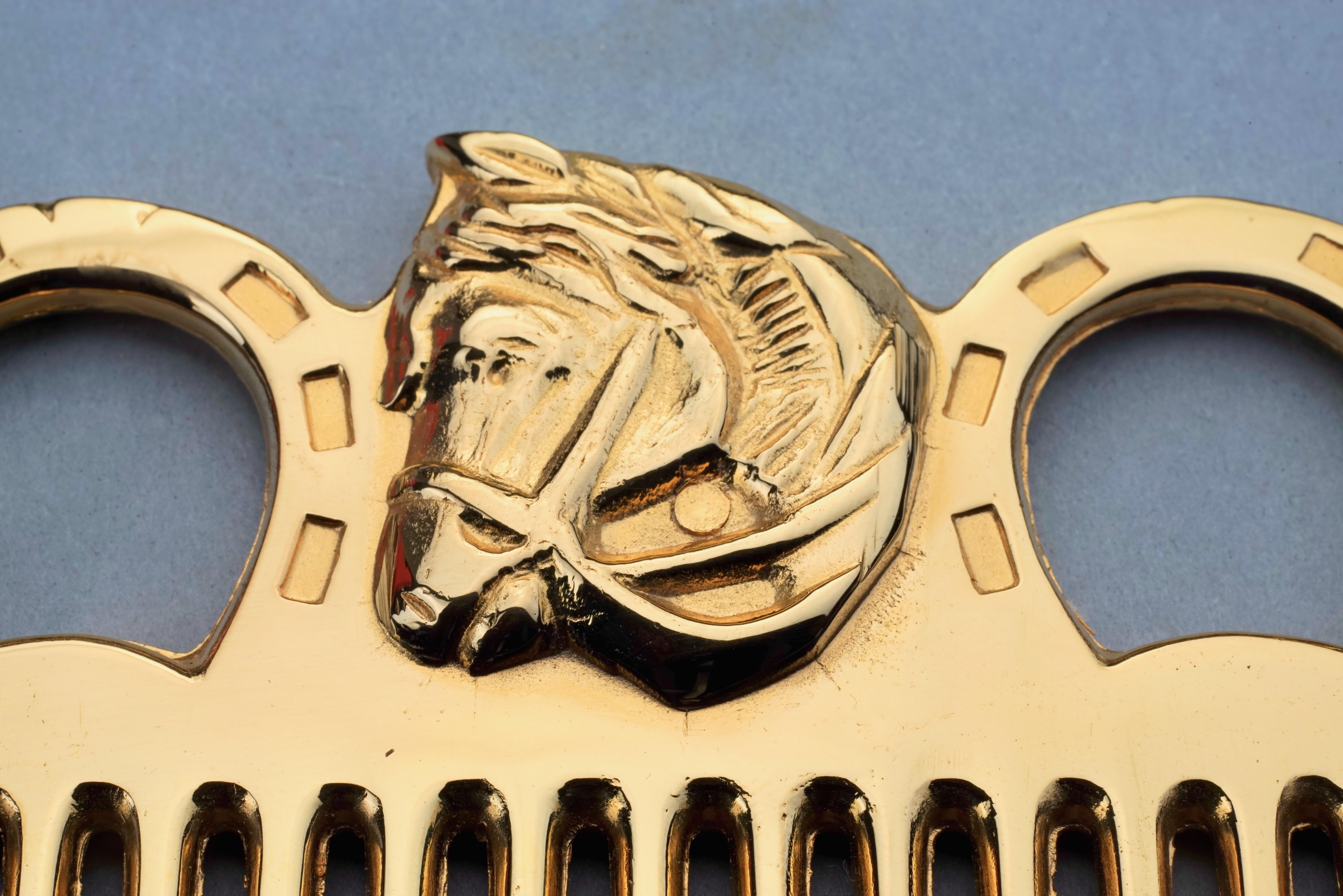 Oro Pettine vintage HERMES con motivo a cavallo in tonalità oro