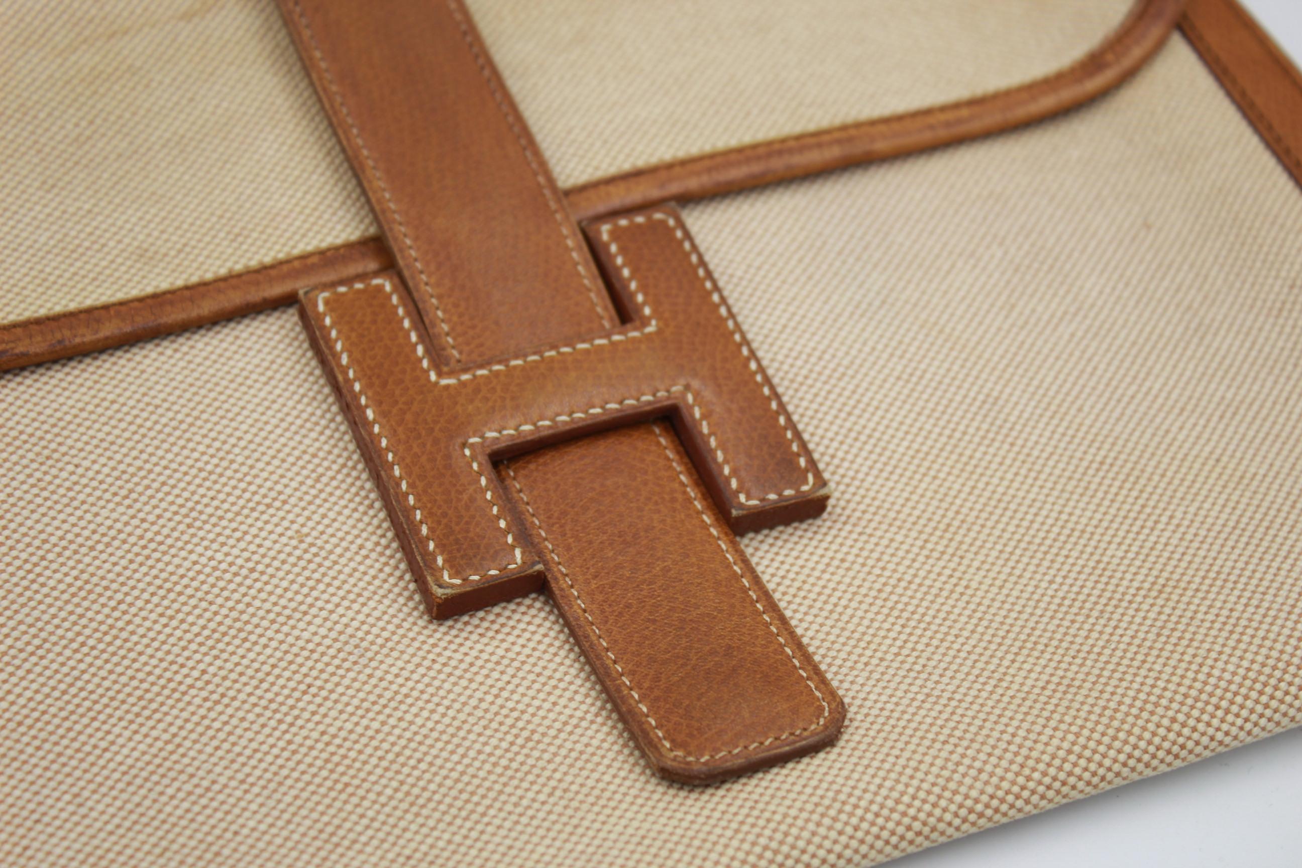 Brown Vintage Hermes Jige MM Clutch in Canvas and Leather.